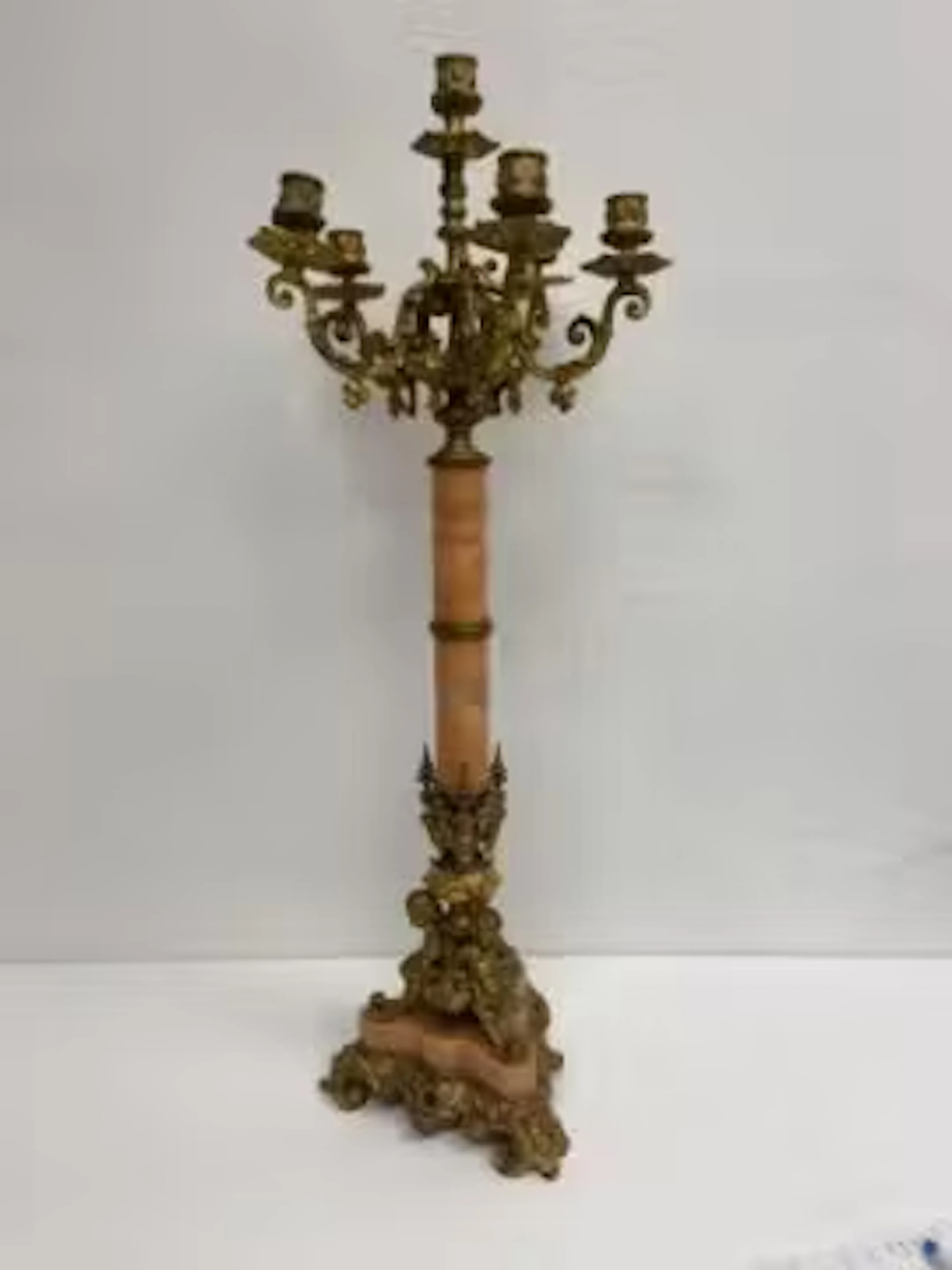 A late 19th century French ormolu and marble six branch table candelabra