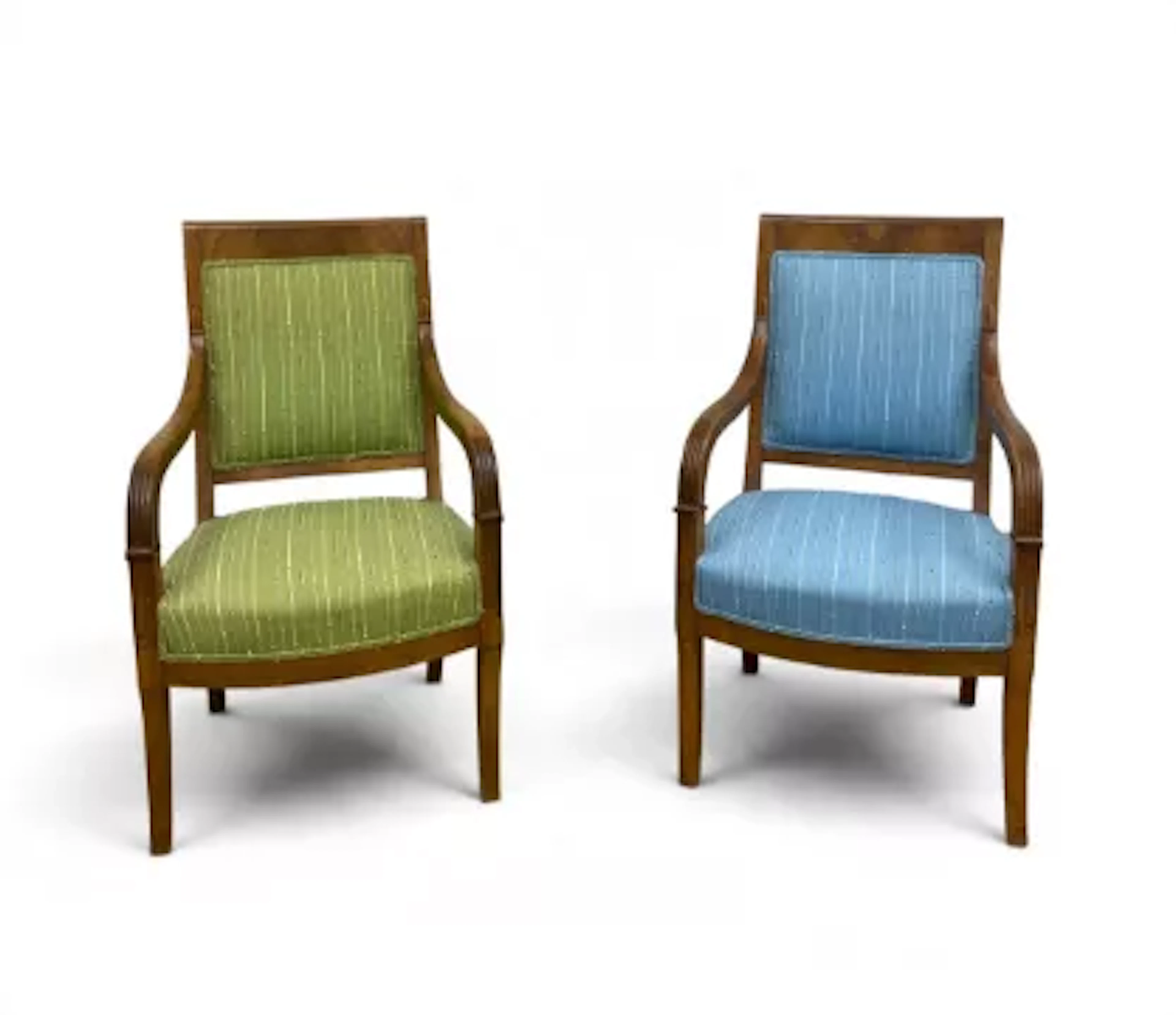 A pair of 19th century Empire style flame mahogany elbow armchairs