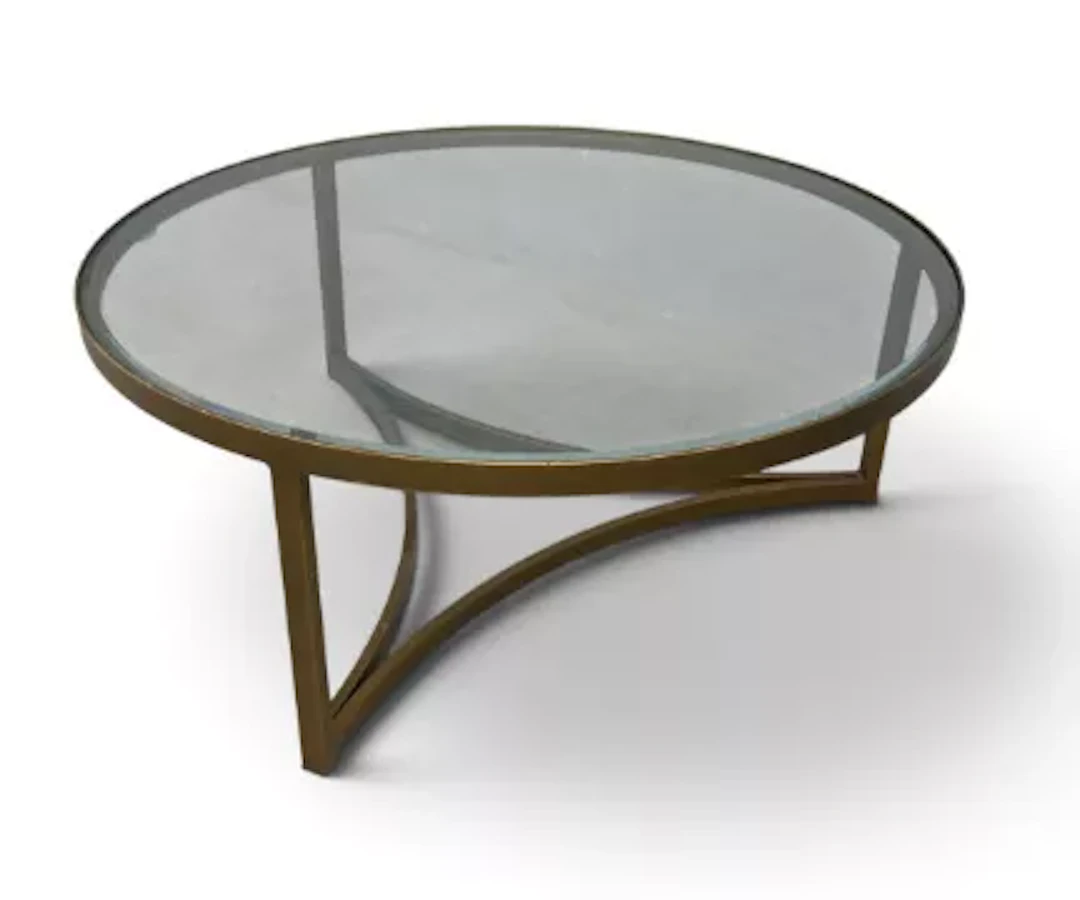 A contemporary circular coffee table, gilt metal and bevelled glass.
