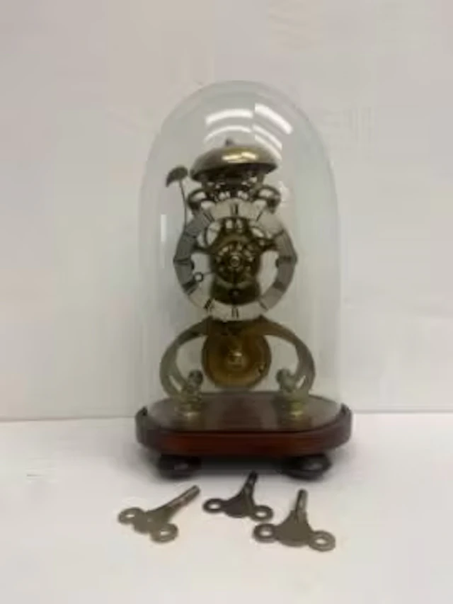 A 19th century brass skeleton clock, the steel dial marked B Jacobs