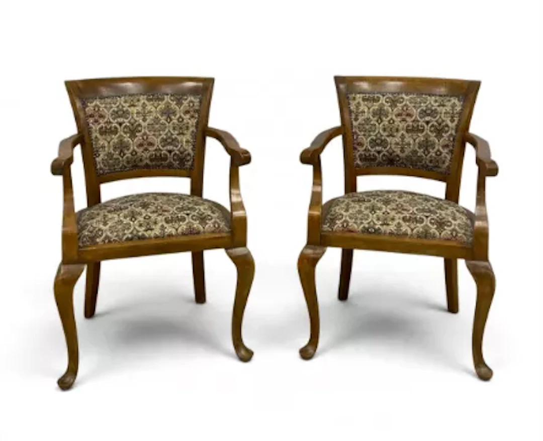 A pair of 19th century European satin walnut elbow armchairs each