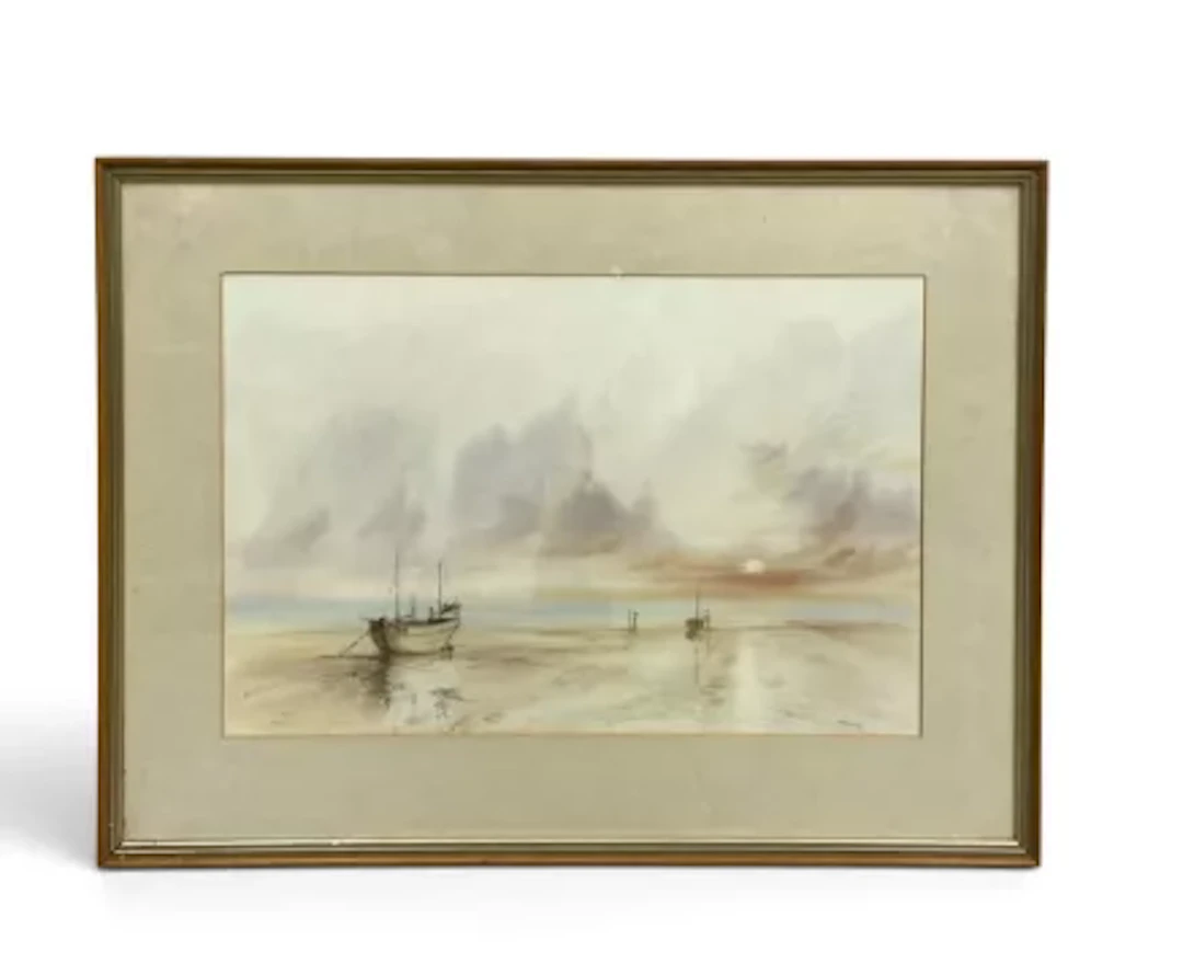 A framed and glazed watercolour, English school, beached boats beneath