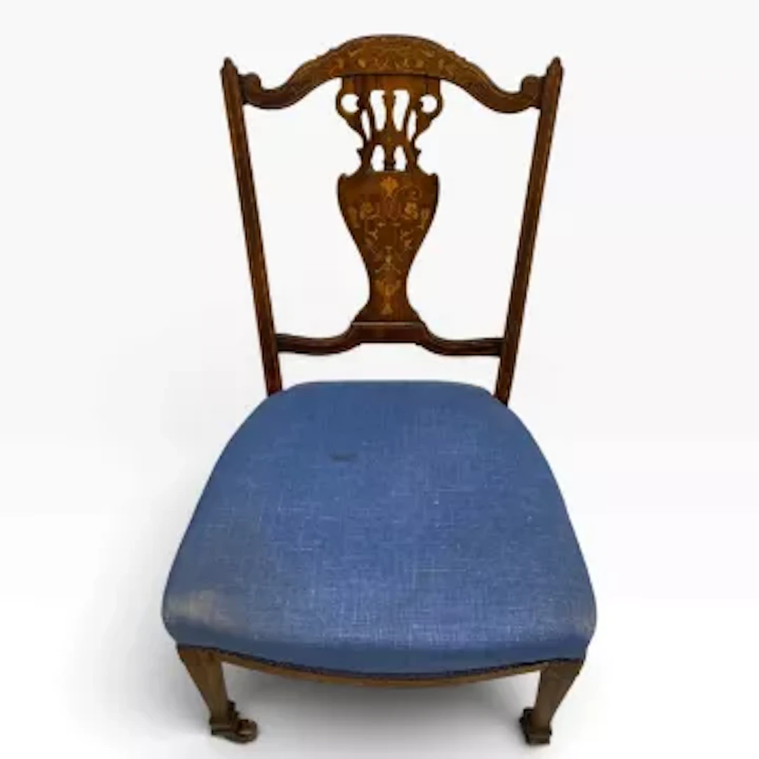 A late 19th century rosewood bedroom chair with satinwood inlaid fret