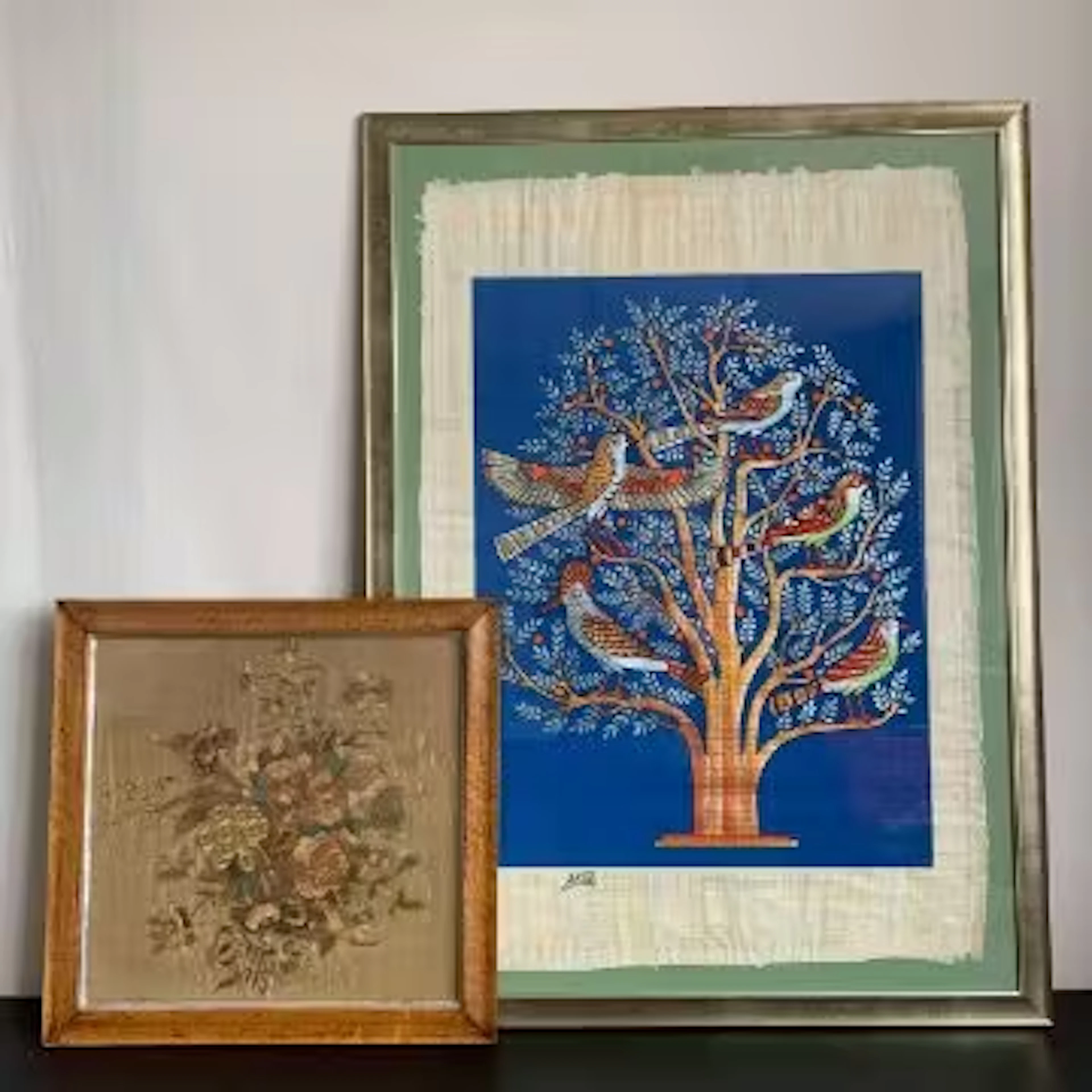 A 19th century tapestry work of a bouquet of flowers, glazed and in