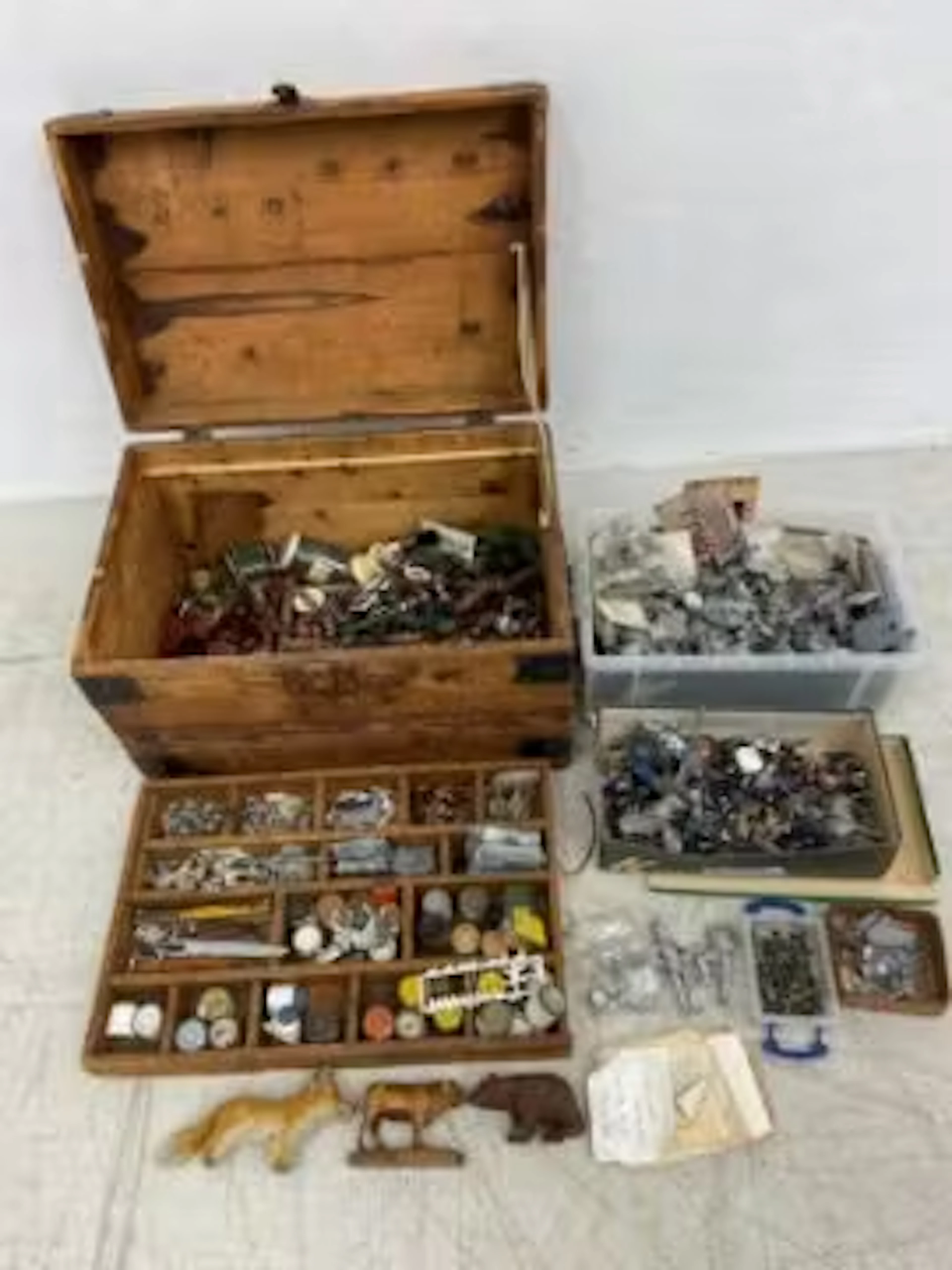 A vintage fitted box containing a collection of lead toys and others