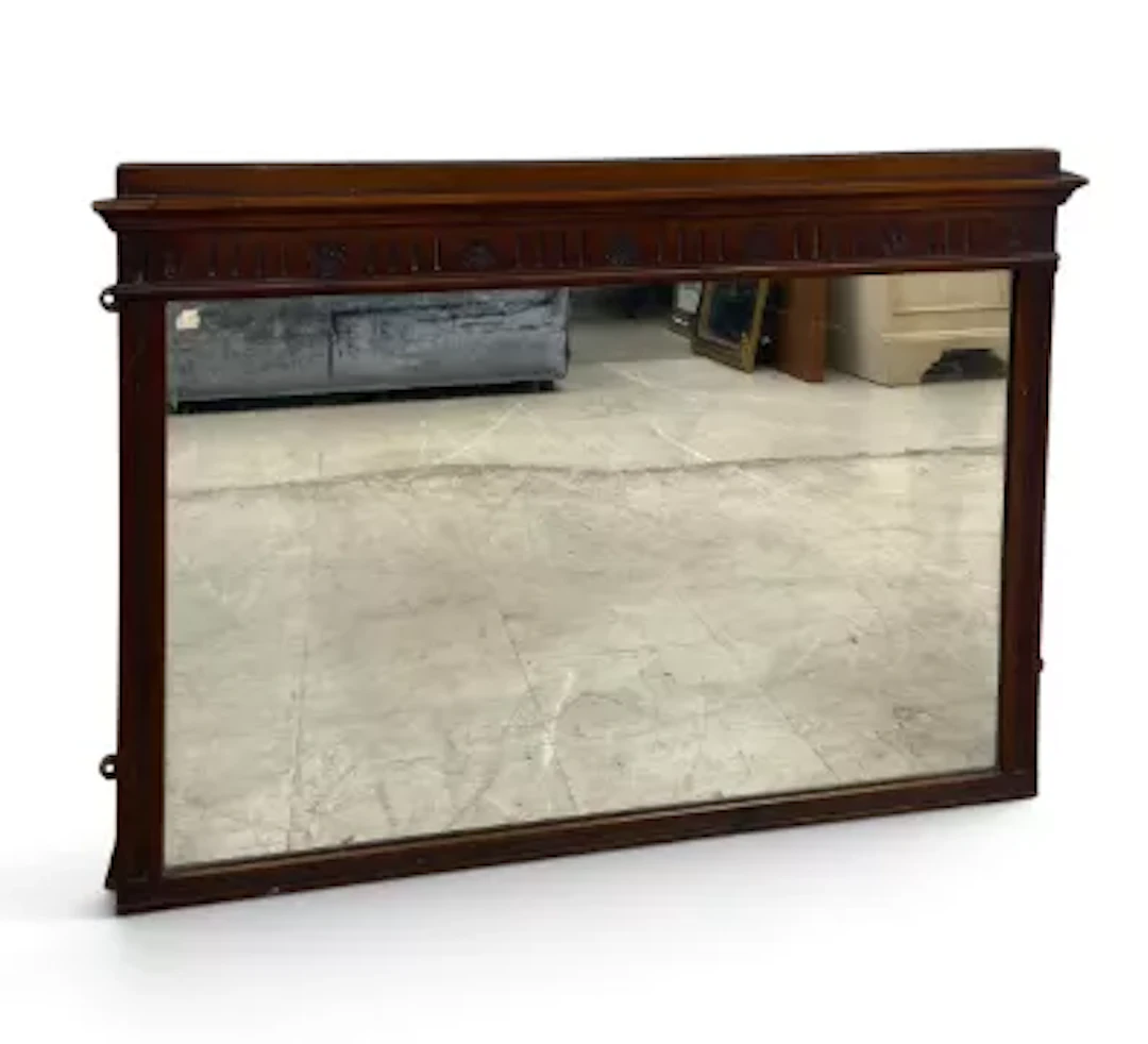 An early 20th century mahogany wall or overmantel mirror, in the Adam