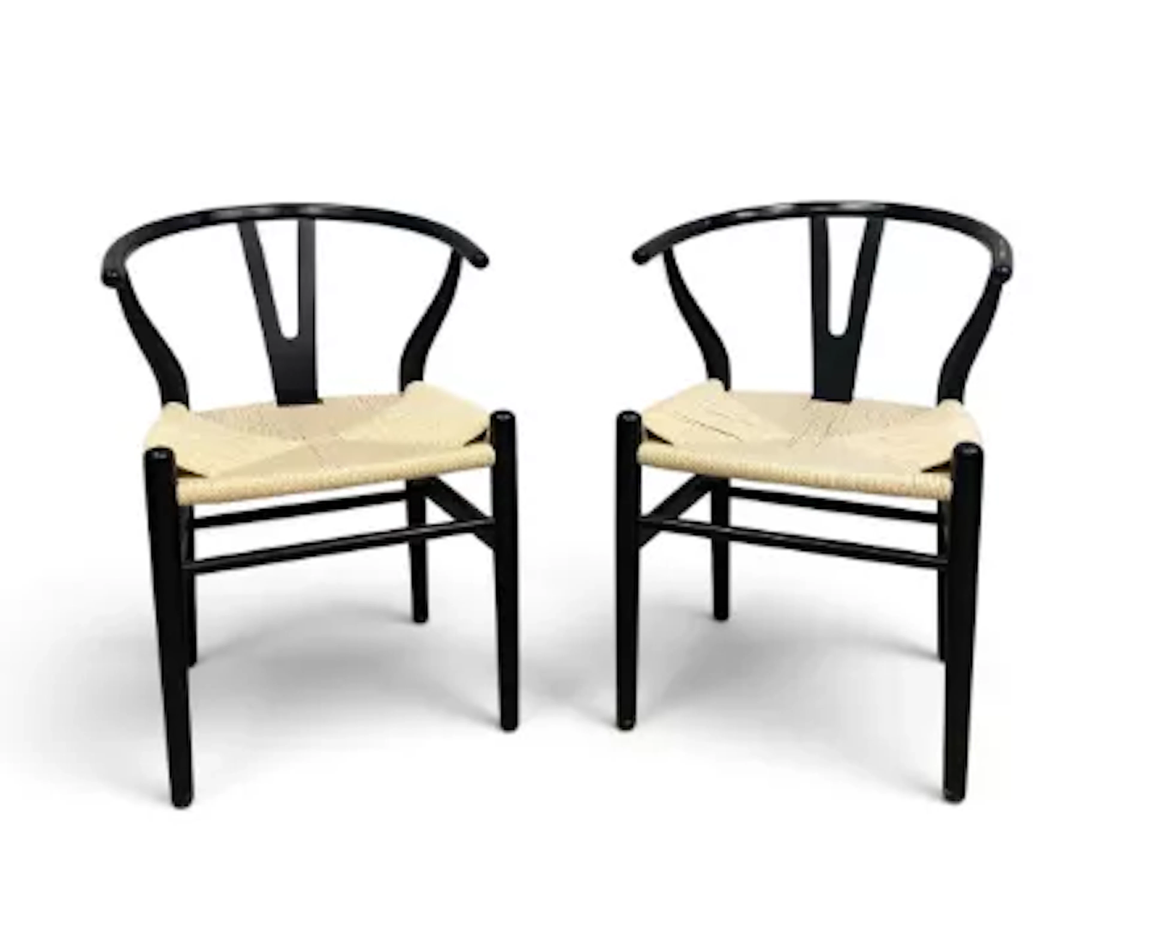 A pair of ebonised wishbone armchairs based on the model CH24 Hans