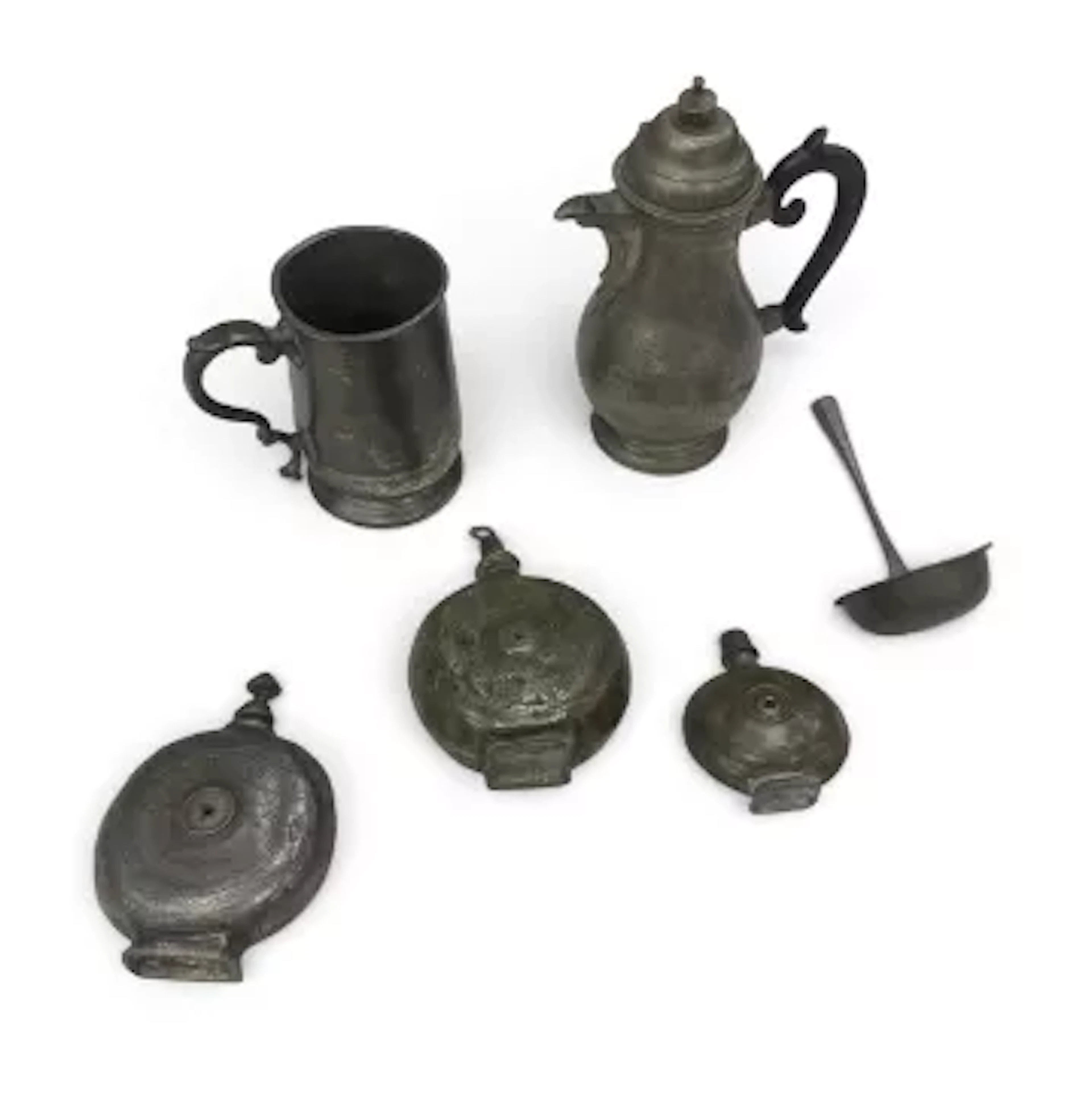 A set of three 19th century graduating pewter flasks with screw tops