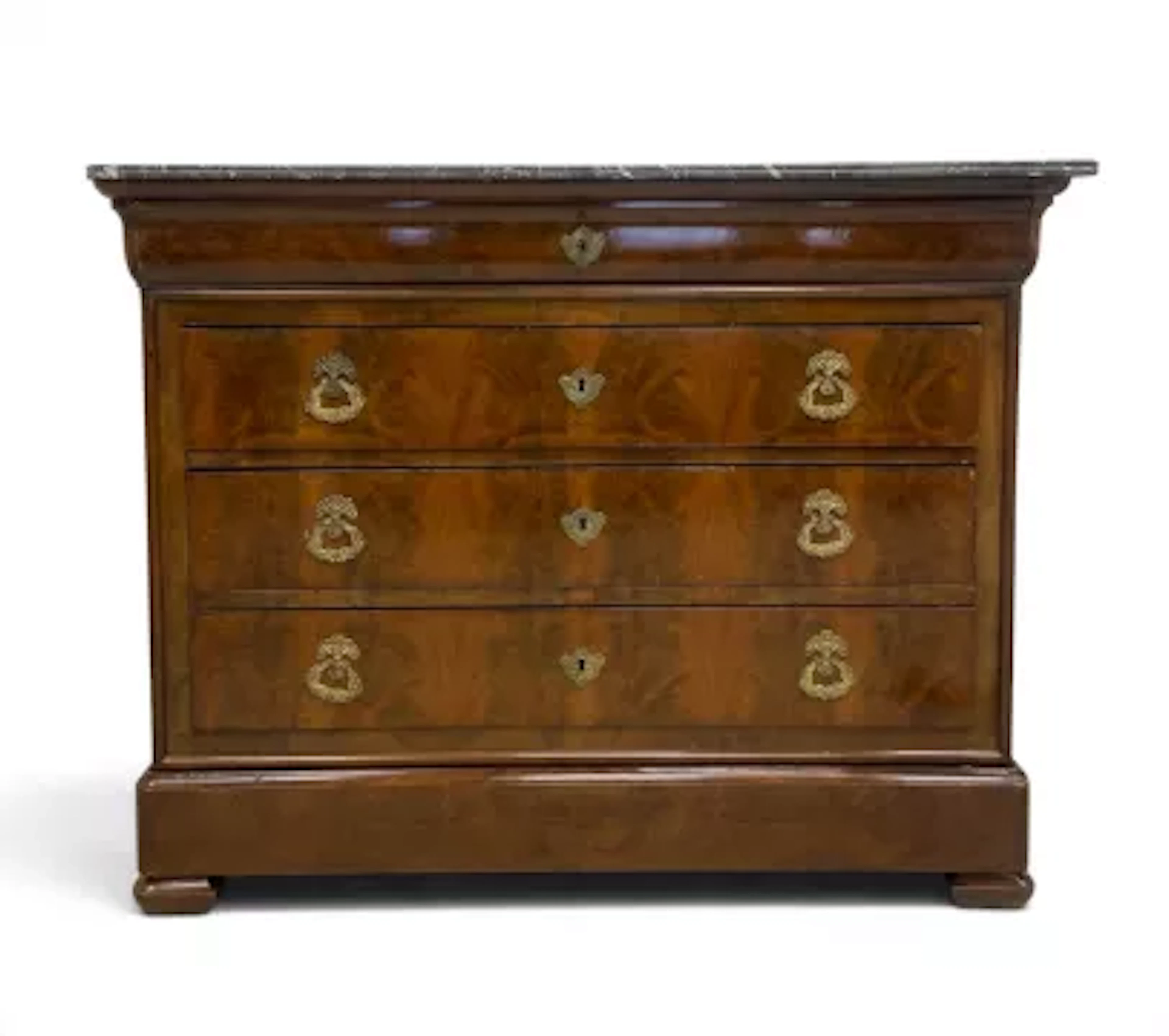 A 19th century Louis Philippe flame mahogany commode chest of drawers