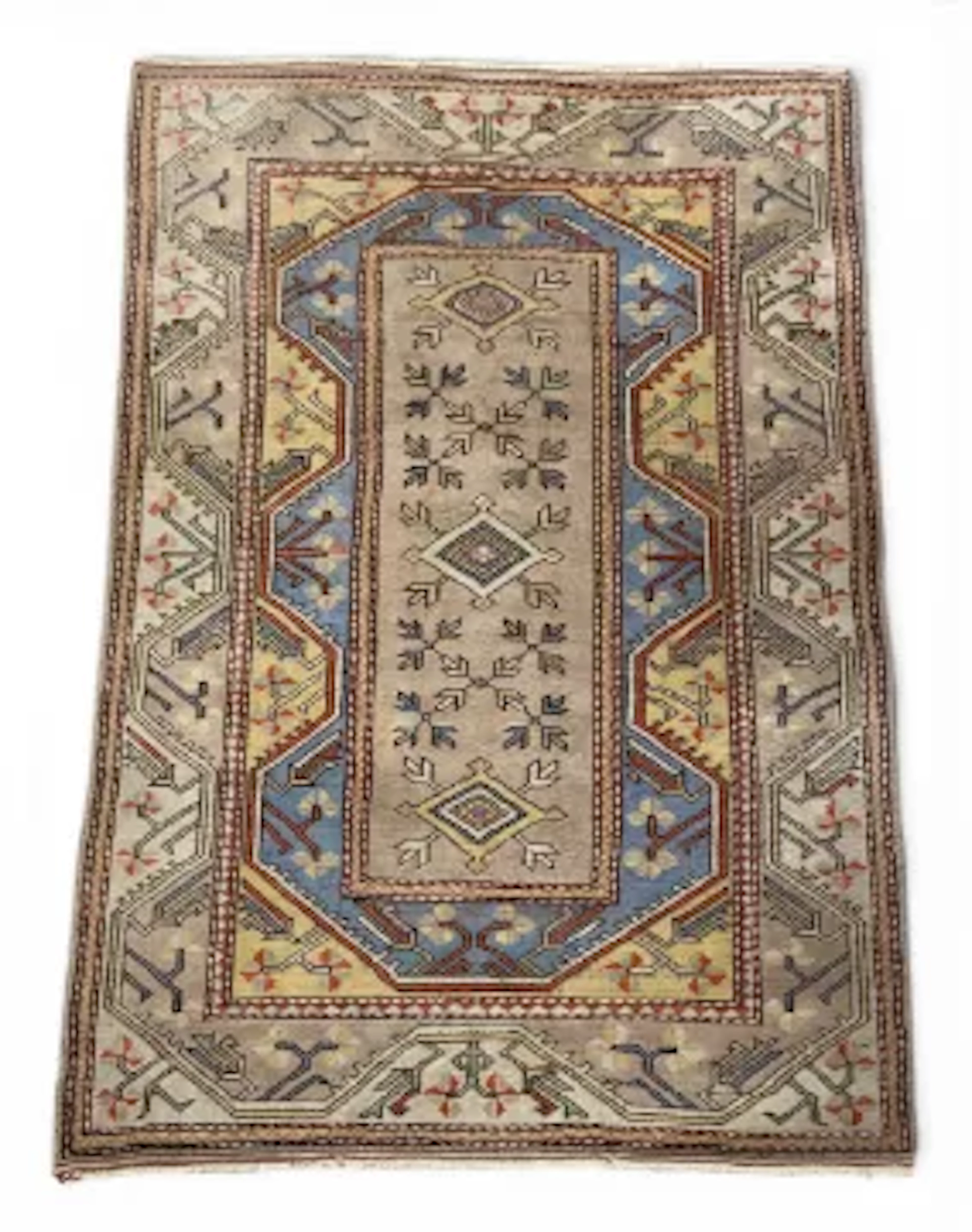A Caucasian Oushak style carpet with a foliate field over the oat