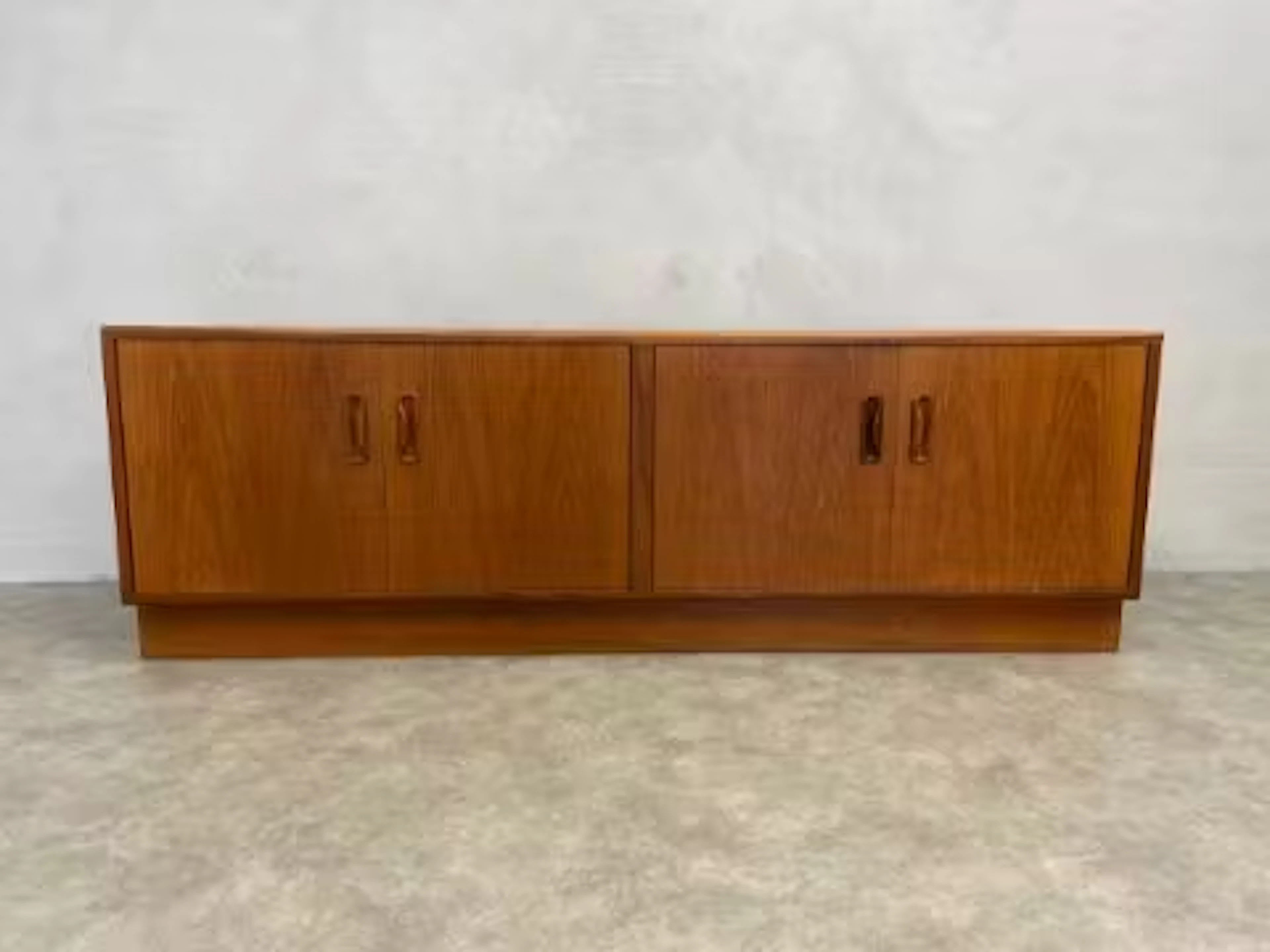 A mid-century teak G Plan low sideboard. H.54 W.162 D.46cm.