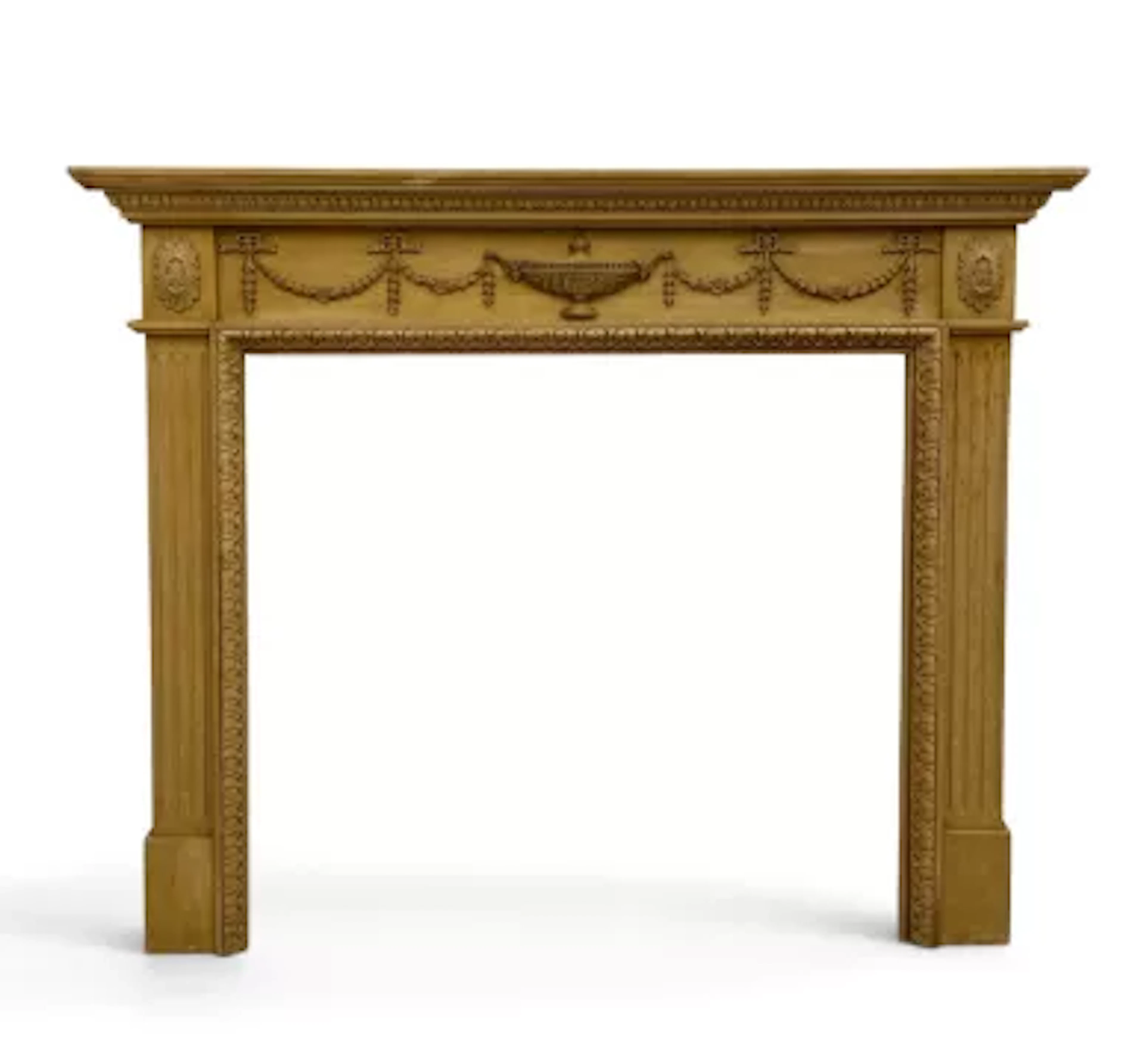 A C.1900 pine fire surround, Adam Revival style with carved frieze
