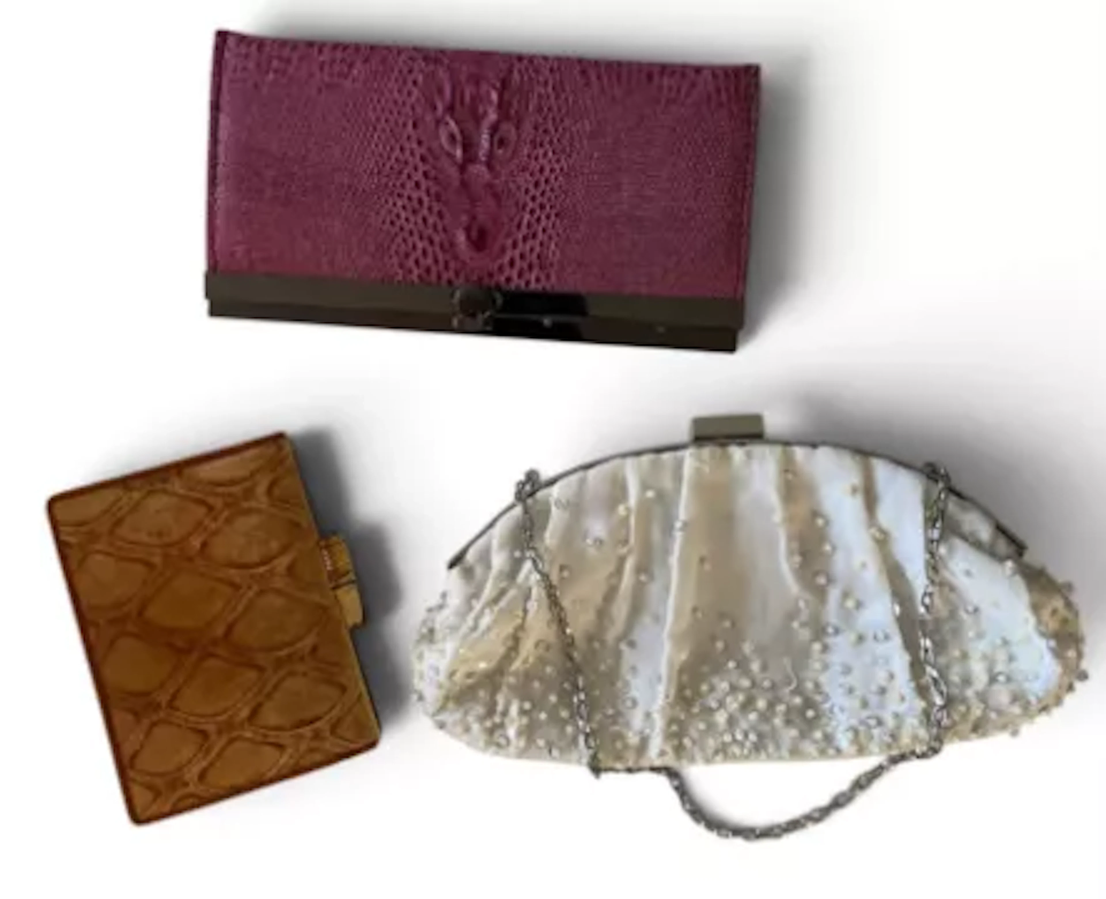 A collection of vintage handbags including; a pink clutch purse with