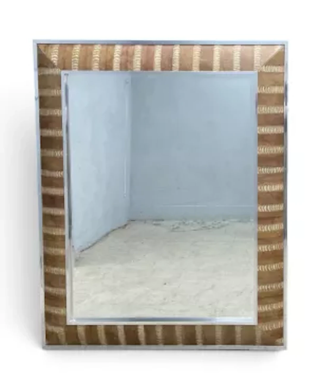 A large contemporary wall mirror with faux snakeskin decoration in