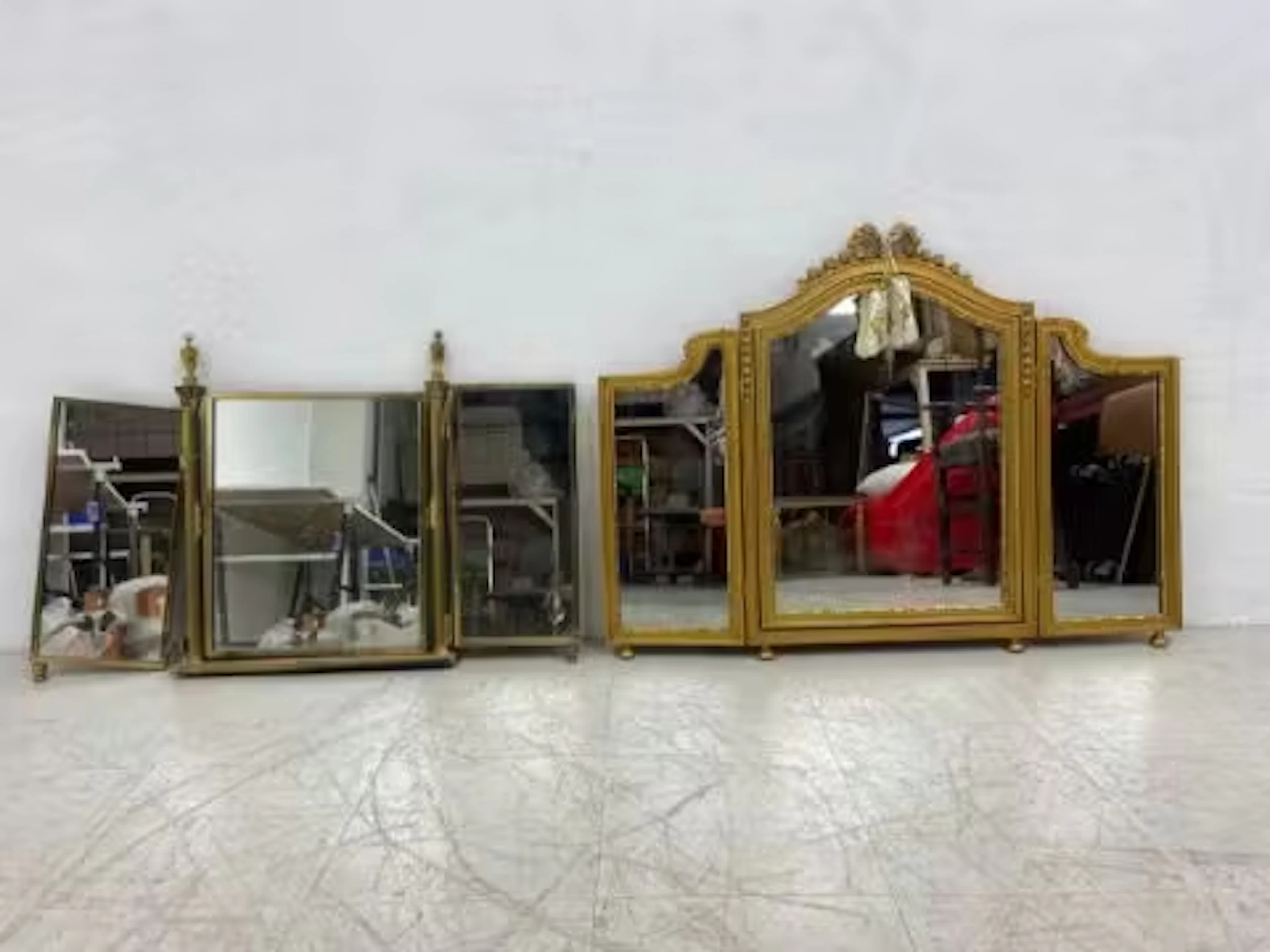 A vintage carved giltwood triptych dressing table mirror along with