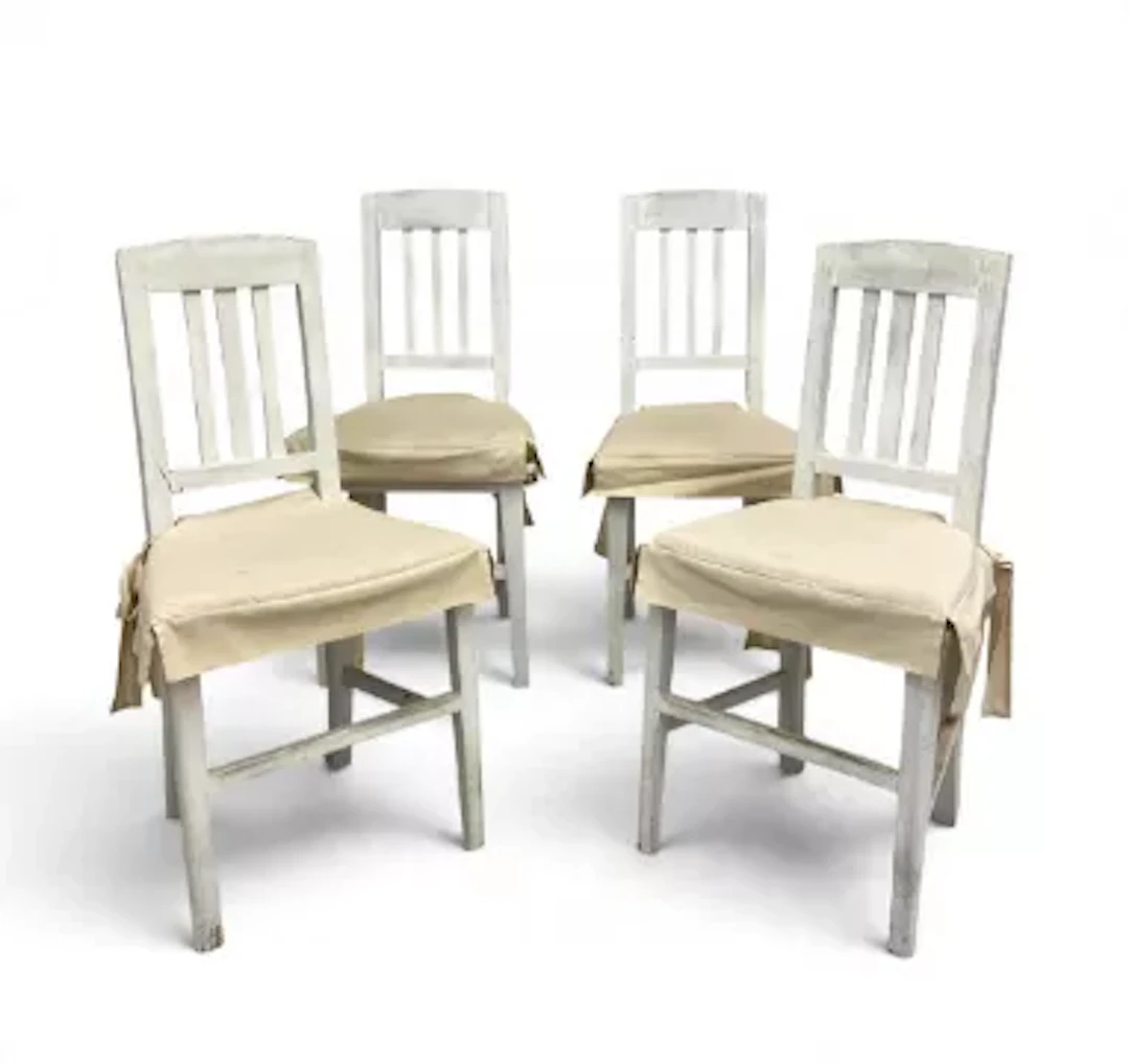 A set of four vintage Scandinavian painted dining chairs fitted with