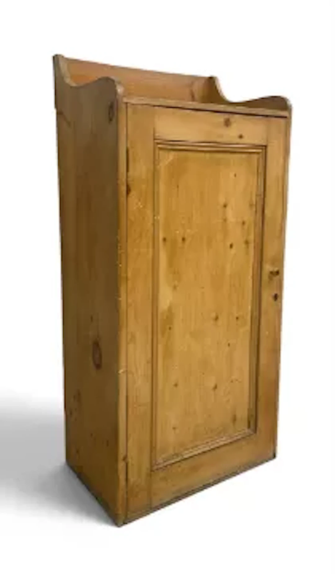 A 19th century pine side cabinet with shaped, galleried top over the
