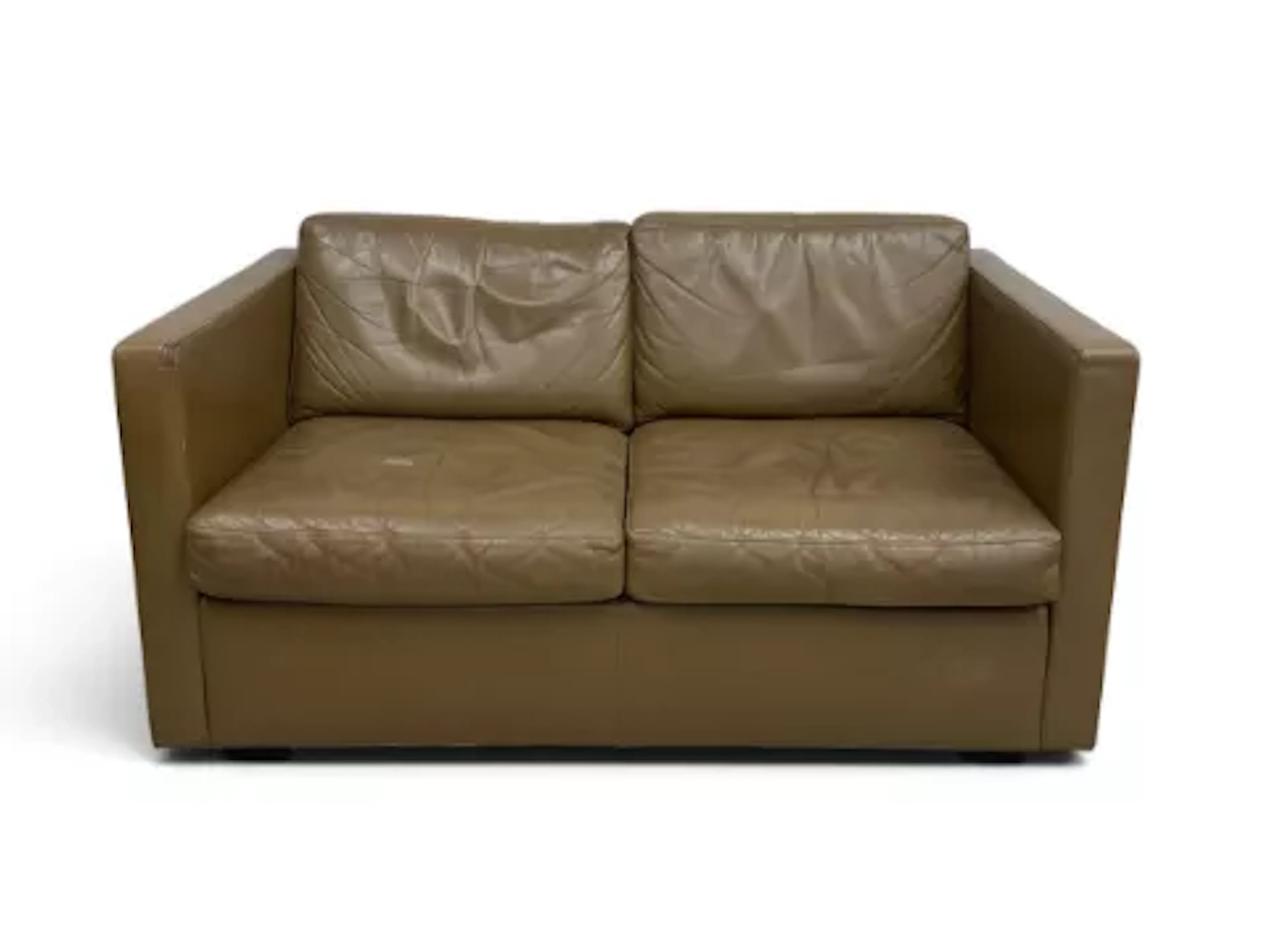 A vintage two seater sofa of compact size in leather upholstery. H