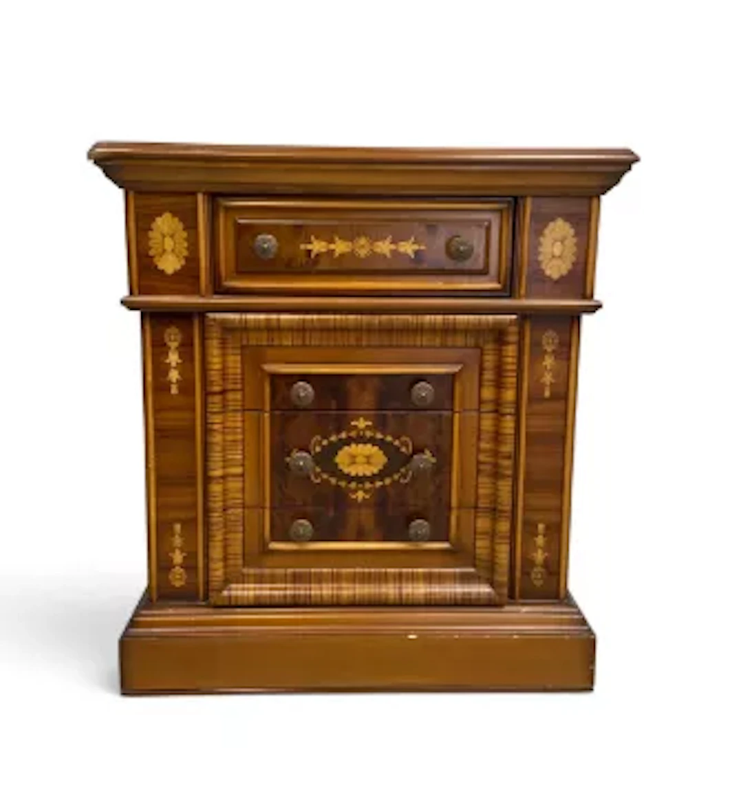 A small Continental style walnut and satinwood inlaid chest of three