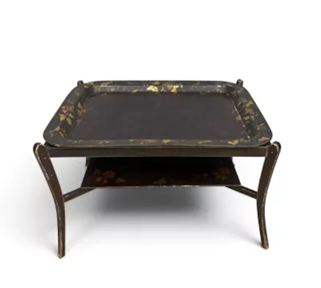 A 19th century papier mache tray on stand with hand decorated gilt