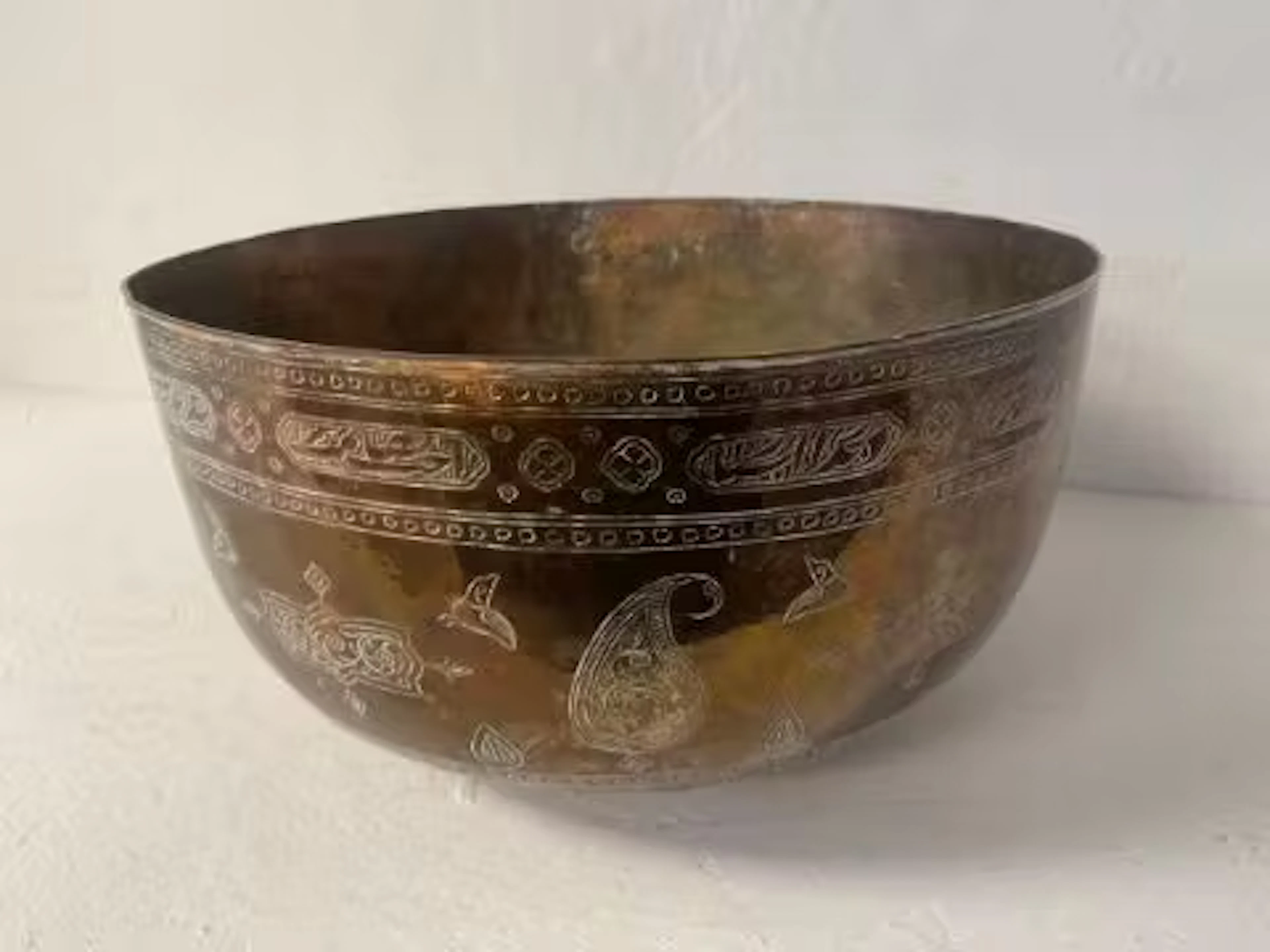 A large possibly 19th century hand formed and engraved Middle Eastern