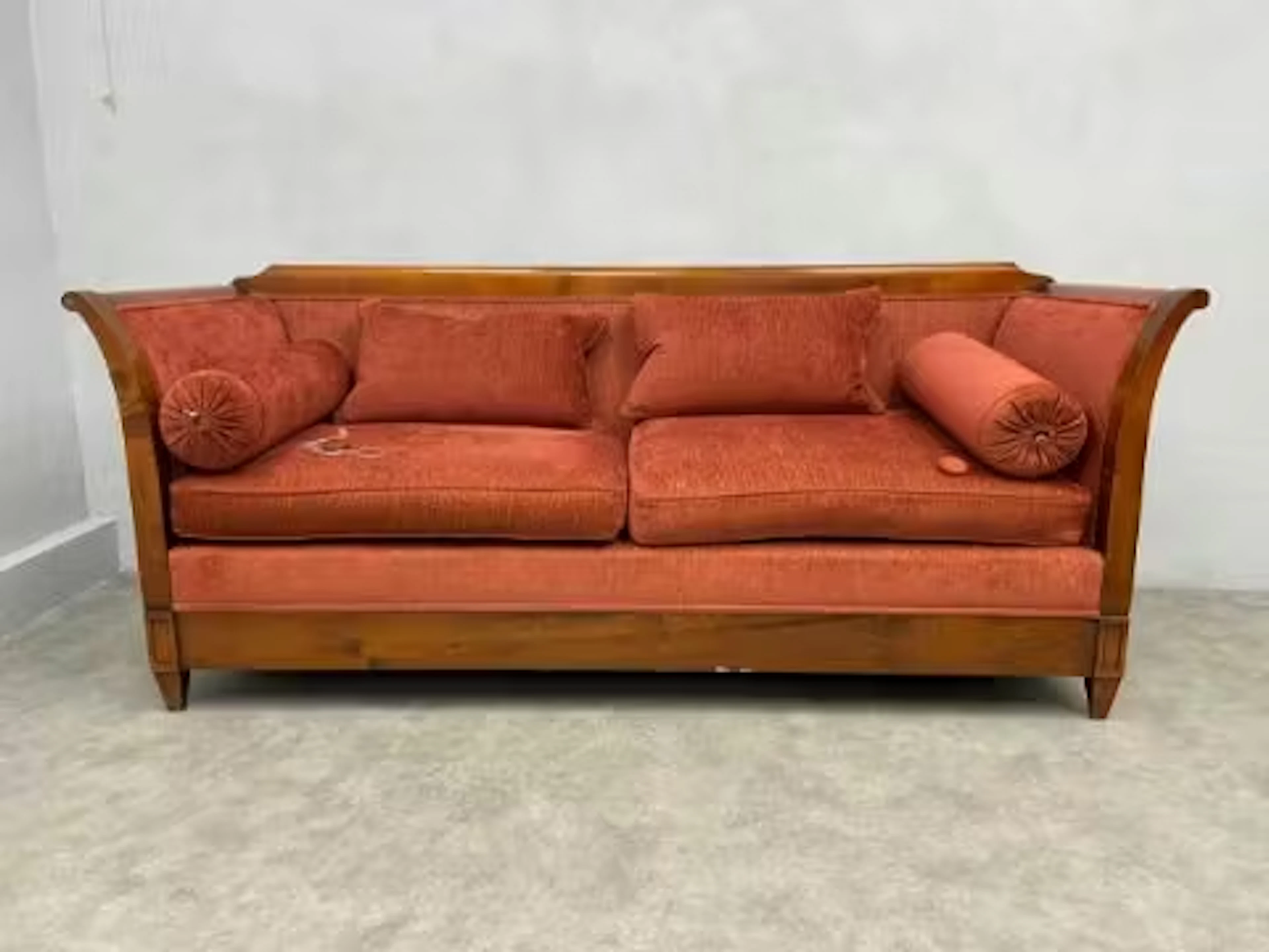 A mid 20th century beech framed Biedermeier style sofa having a scrolled