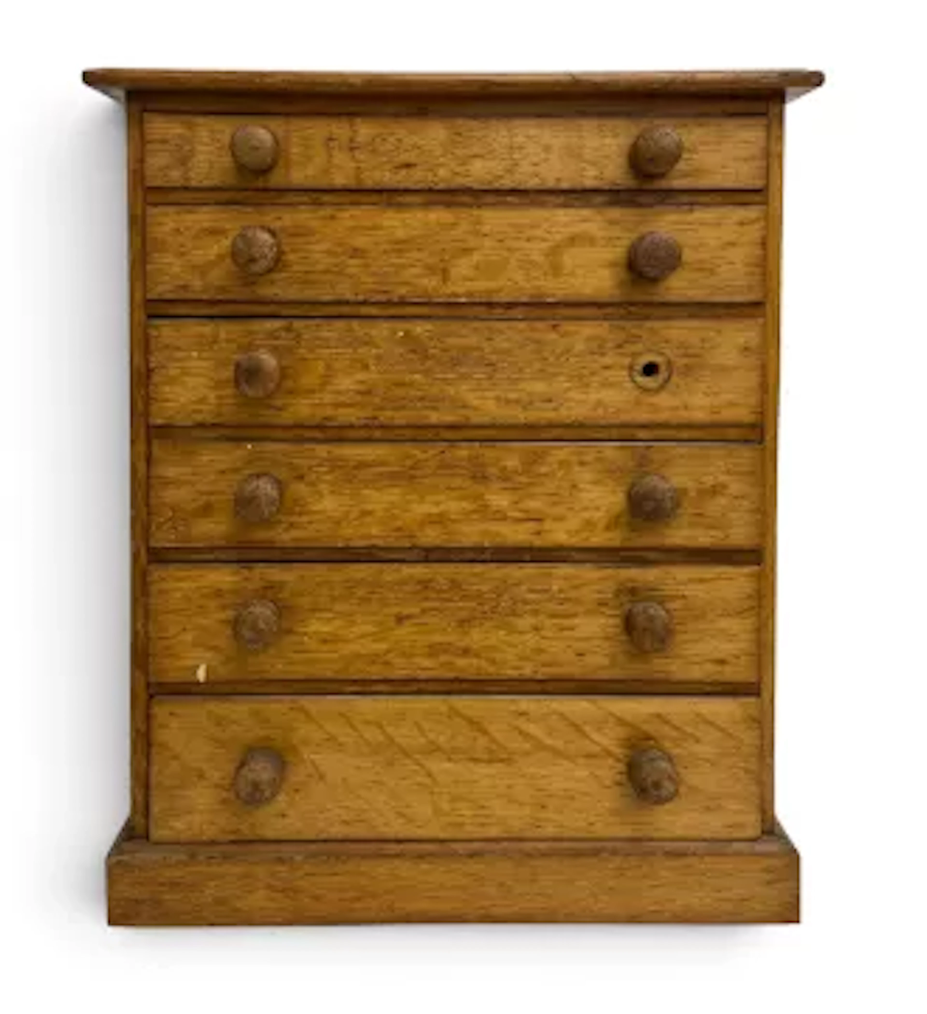 A 19th century light oak table top collectors chest of six graduating