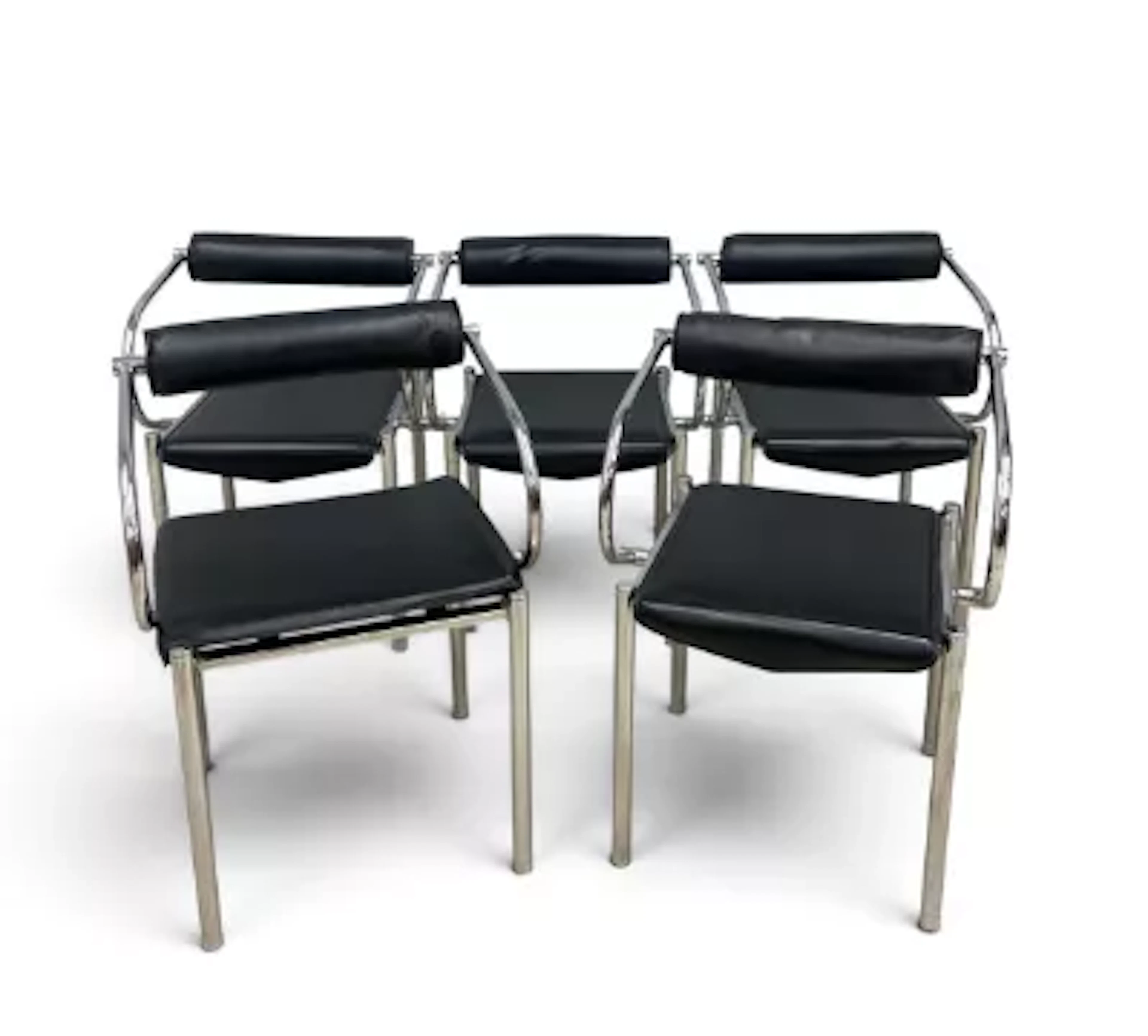 A set of six faux leather and stainless steel dining chairs, in the
