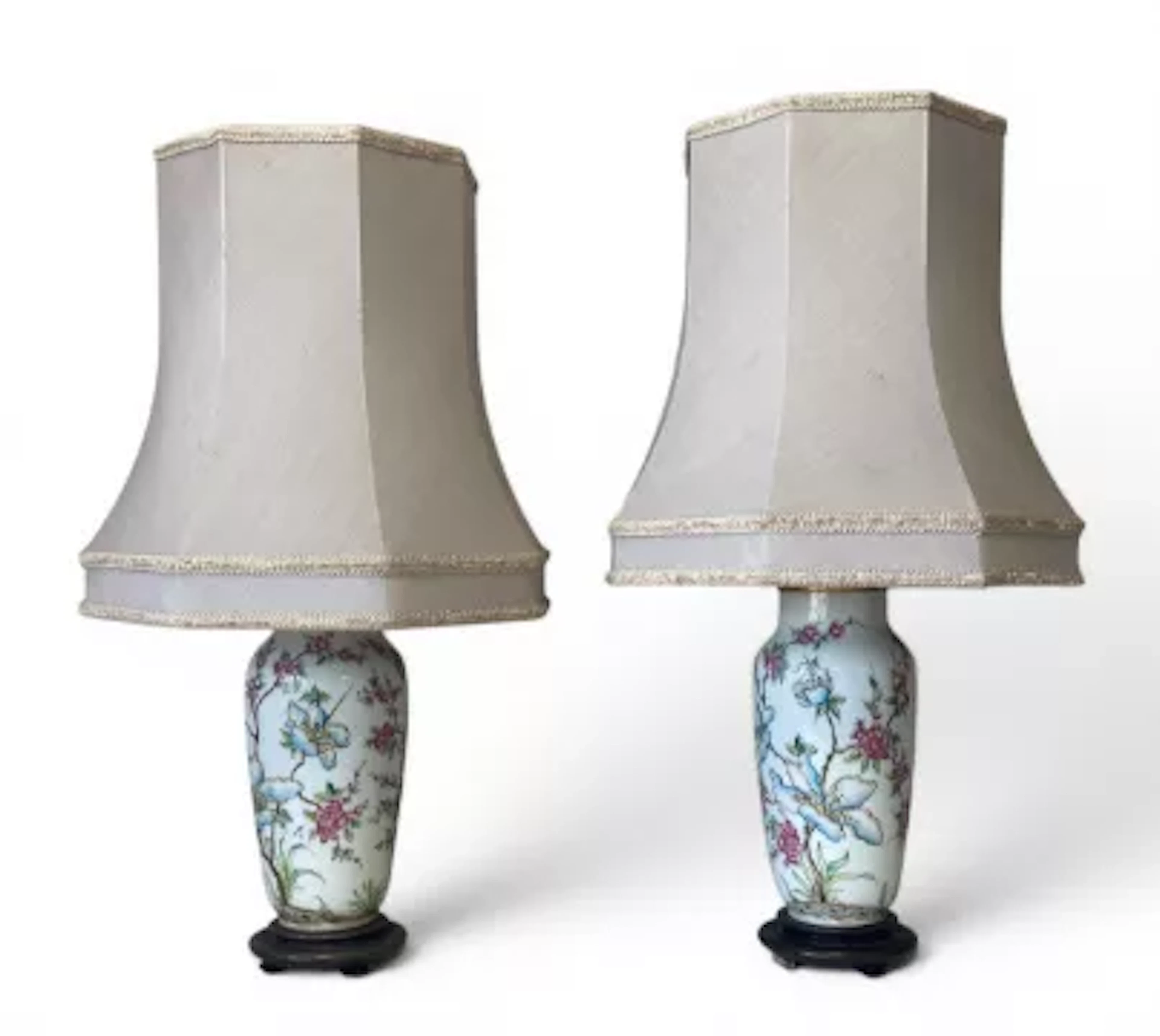 A pair of vintage Oriental style porcelain vase lamps with shades.
