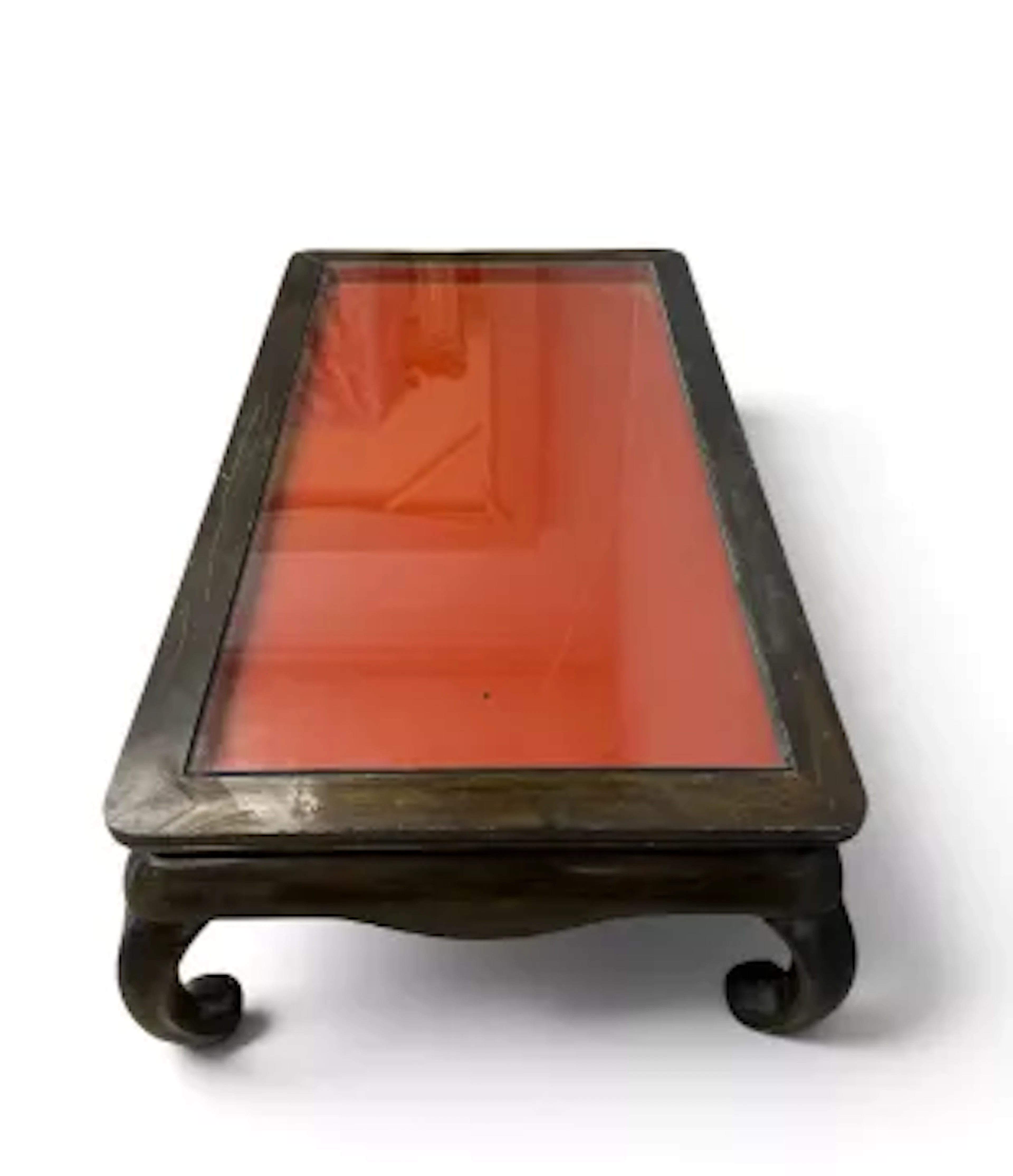 A Chinese padouk coffee table with a drop in plate glass surface above