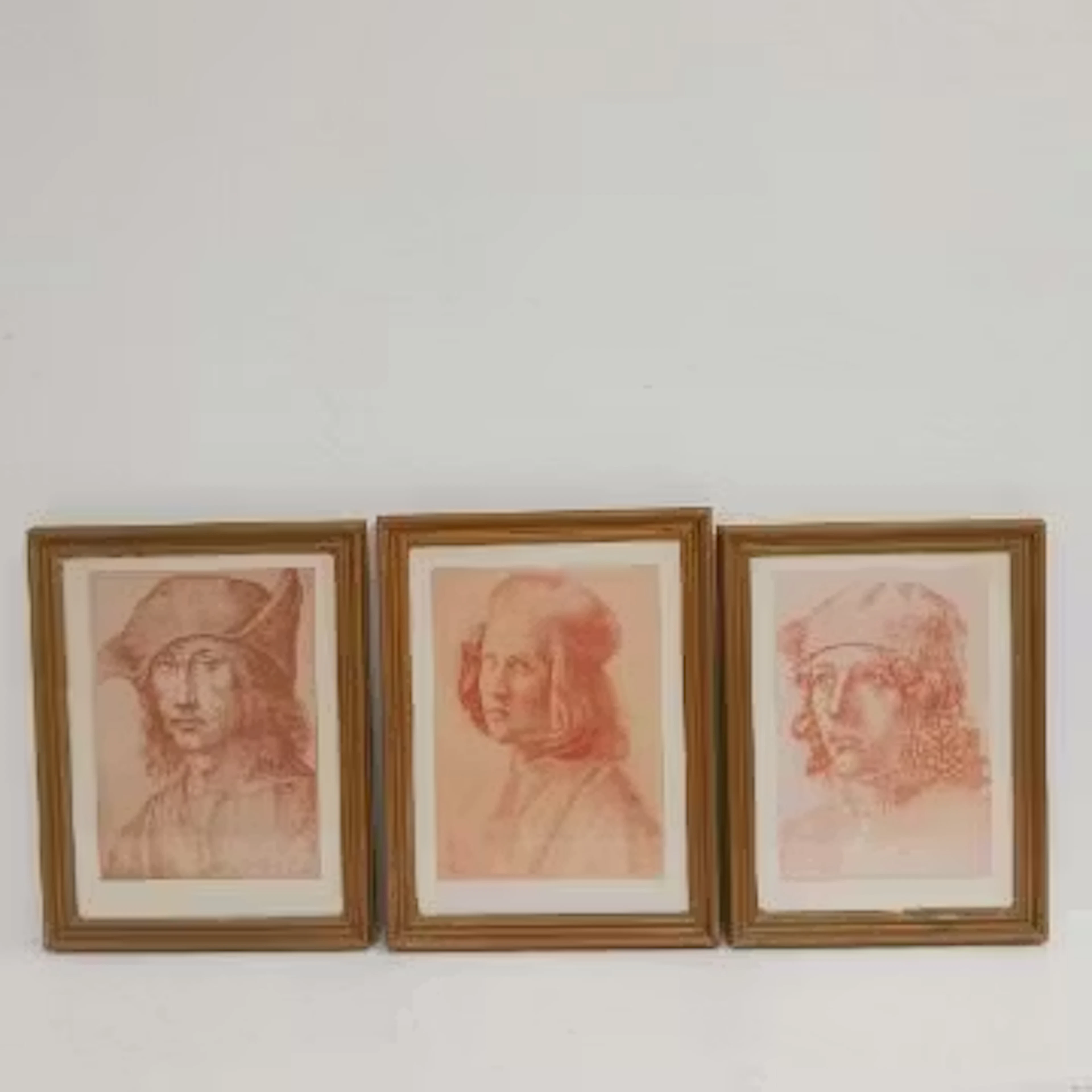 A set of three framed and glazed lithographs after the original Italian