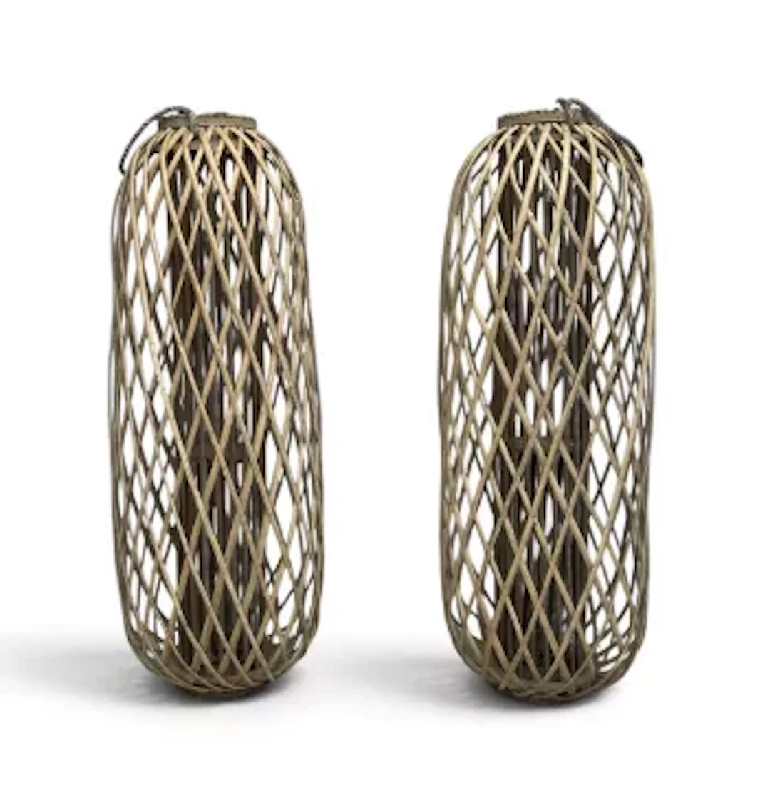 A large pair of contemporary wicker hurricane lanterns, glass inserts