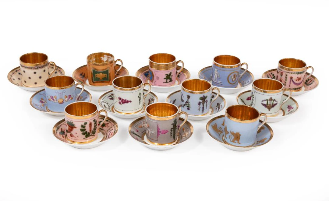Collection of Twelve Paint Decorated and Gilded Cups and Saucers