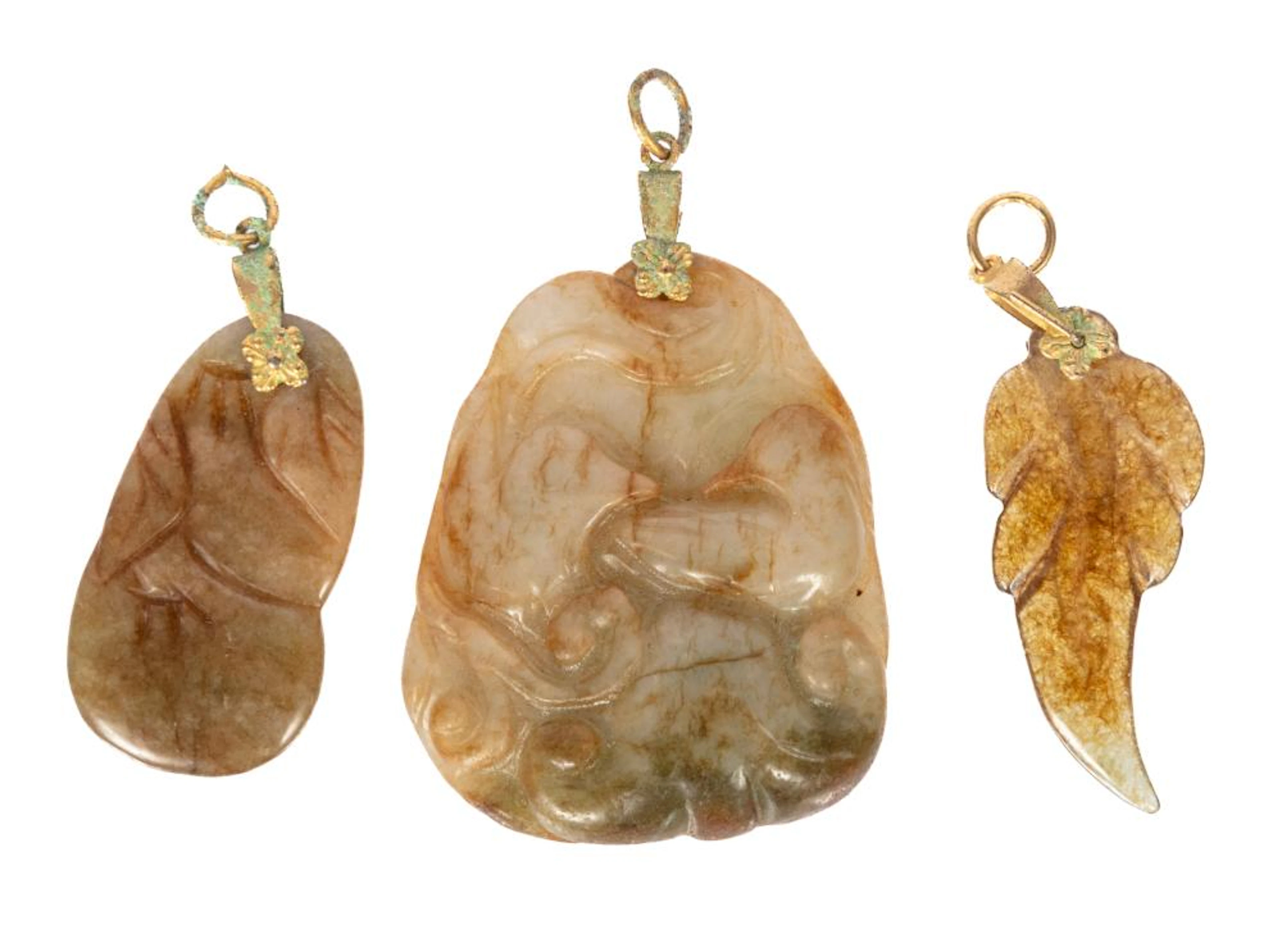 Three Chinese Carved Hardstone Pendants