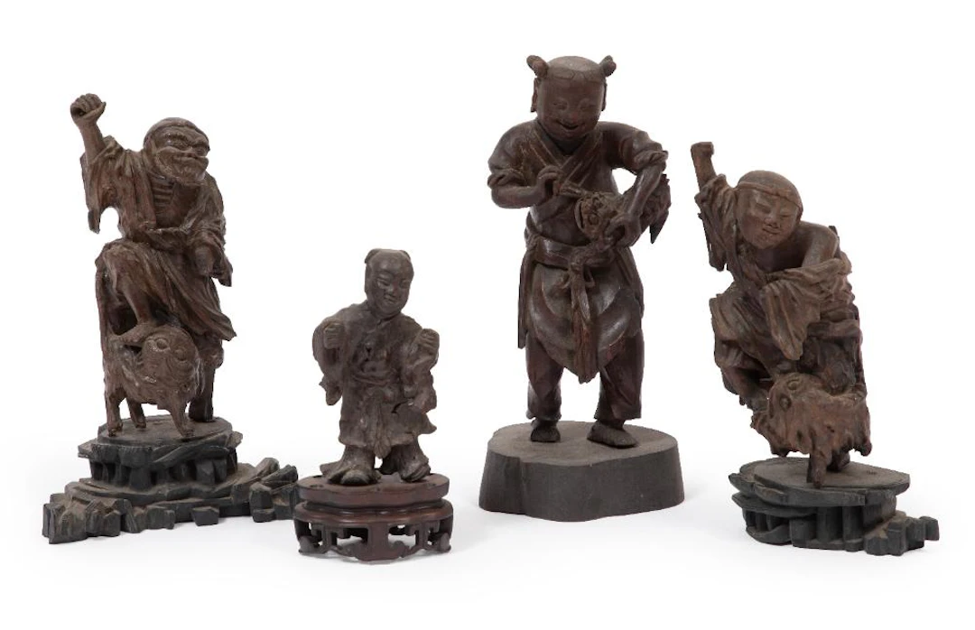 Four Chinese Carved Wood Daoist and Folk Figures on Stands