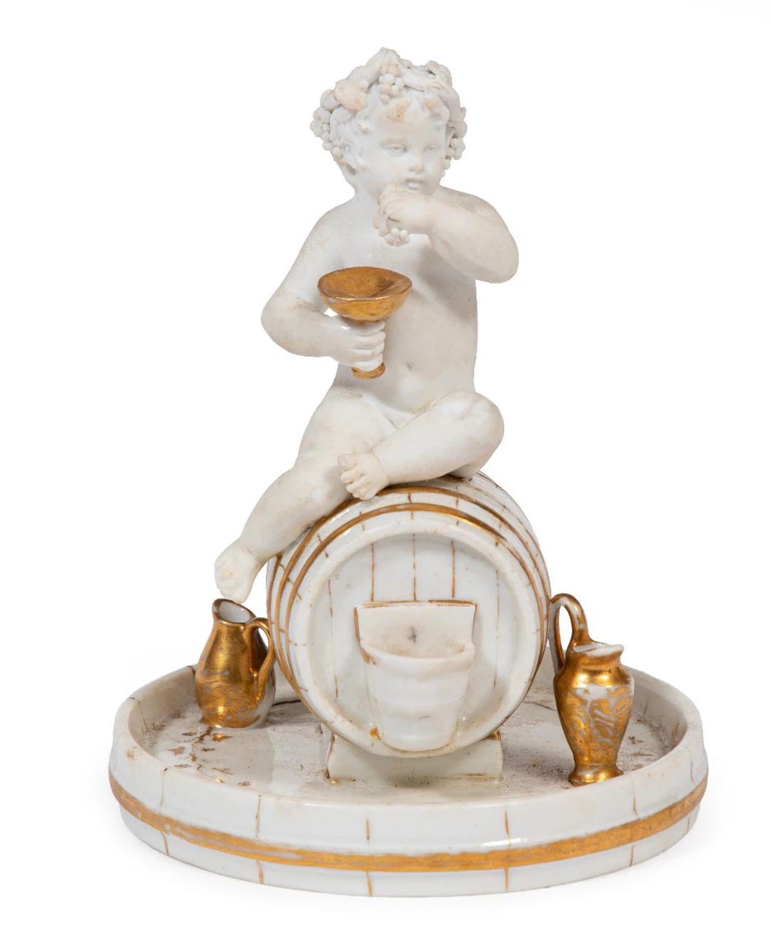 Paris Porcelain Gilt Decorated Figure of a Young Bacchus on a Wine Barrel