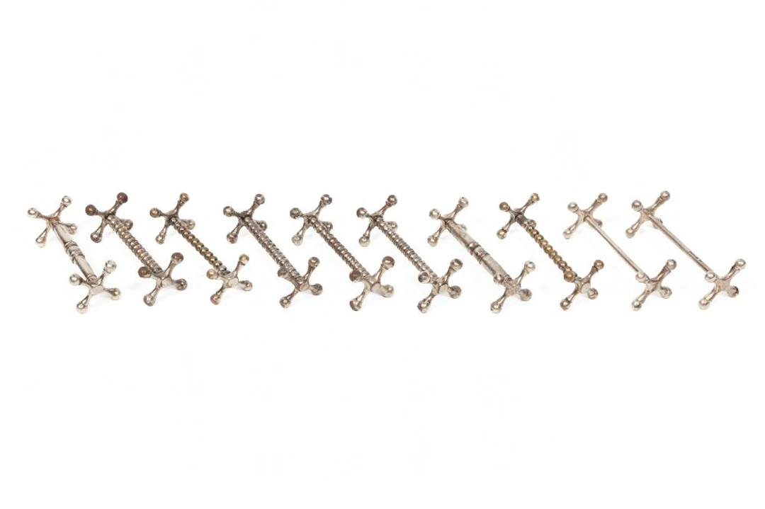 Associated Group of Ten Silver and Silverplate Knife Rests