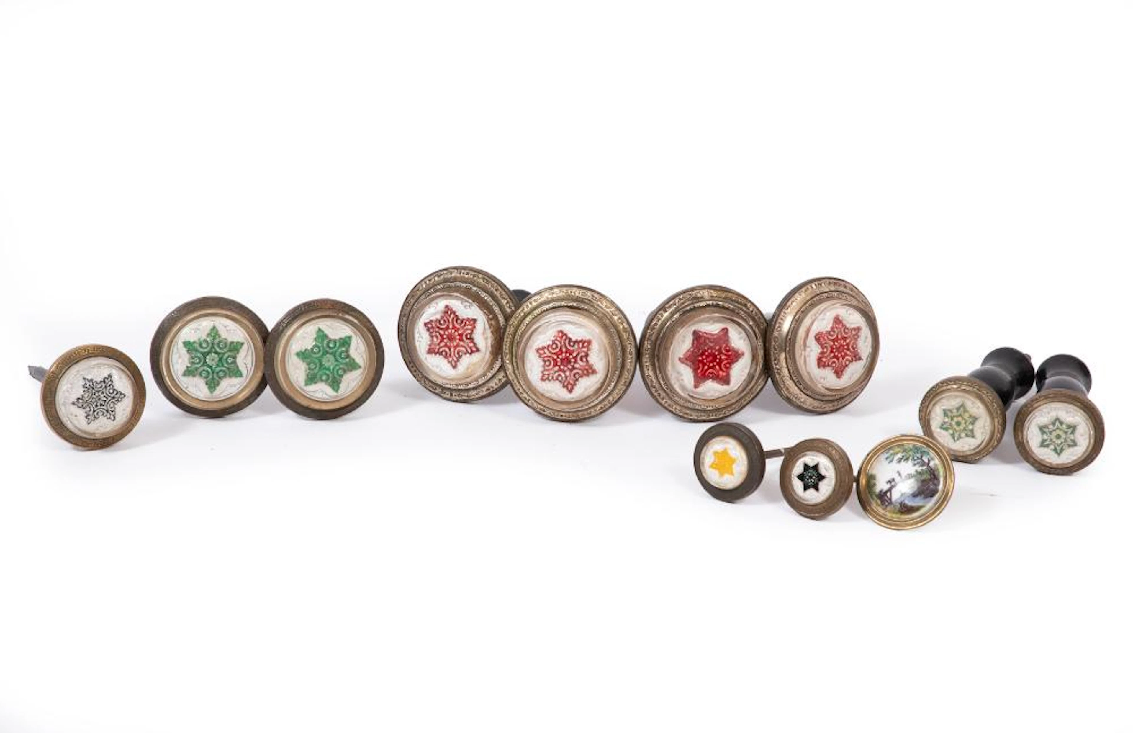 Twelve Victorian Enamel Decorated Pressed Glass Tiebacks