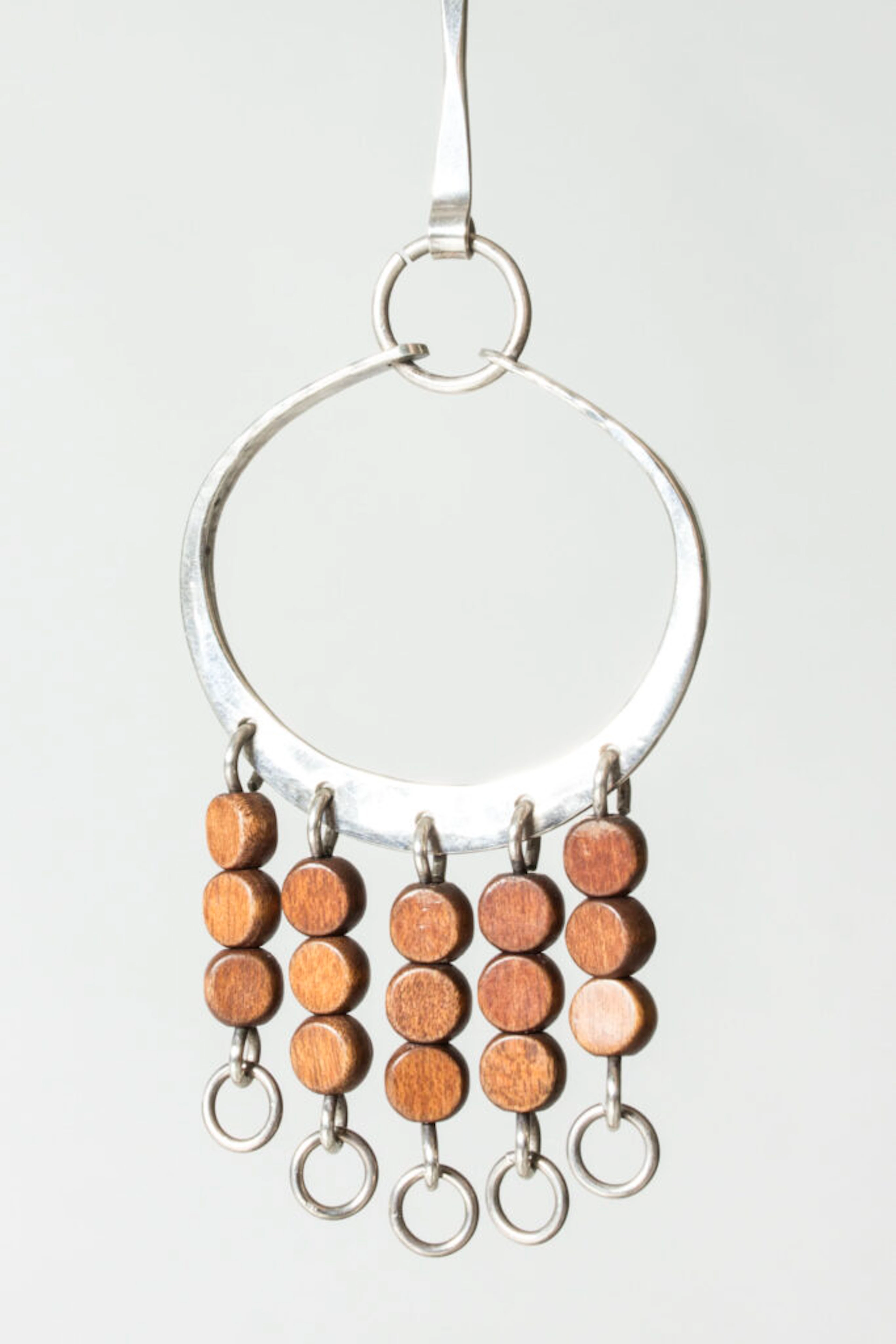 Silver and wood pendant by Anna Greta Eker