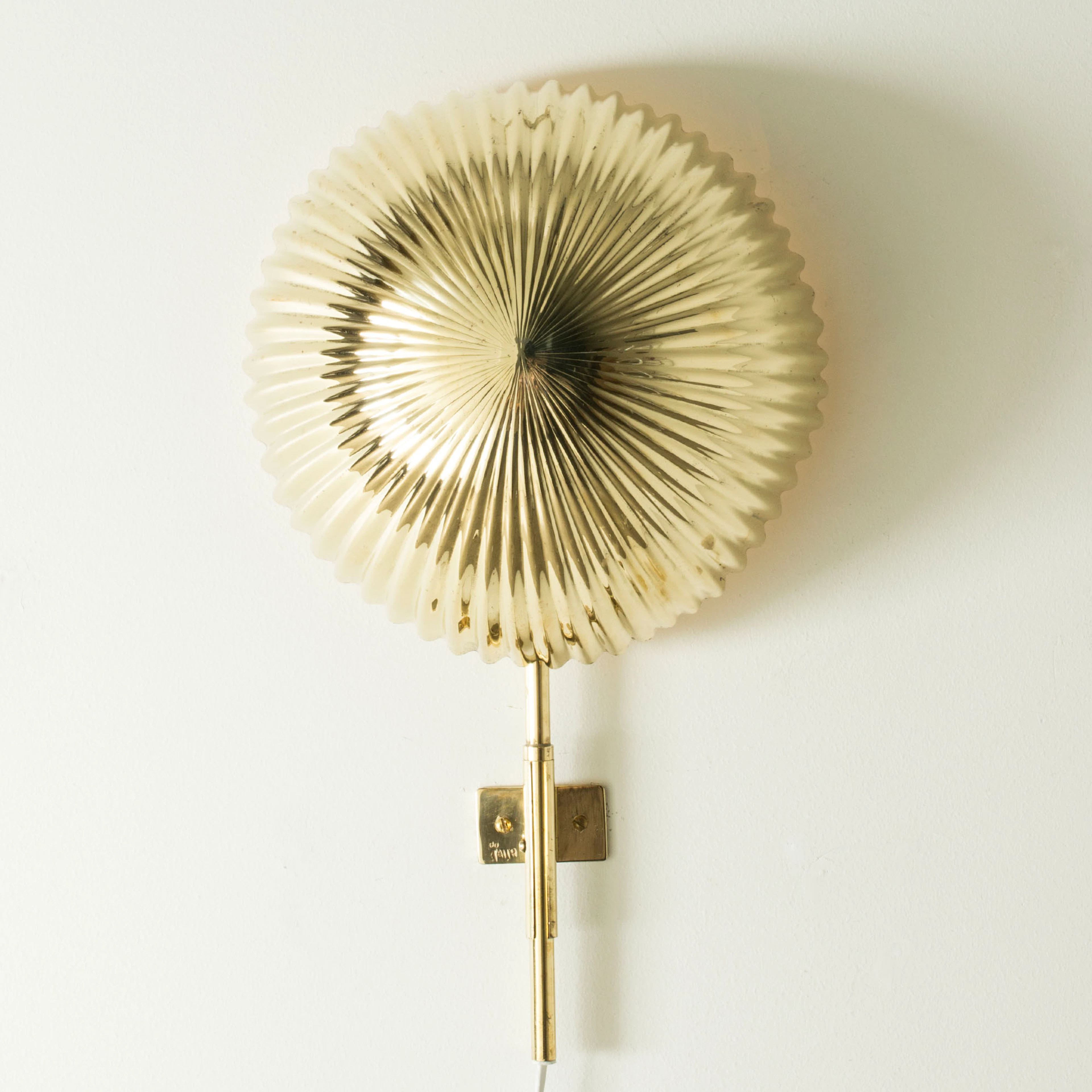 Midcentury brass wall light by Paavo Tynell