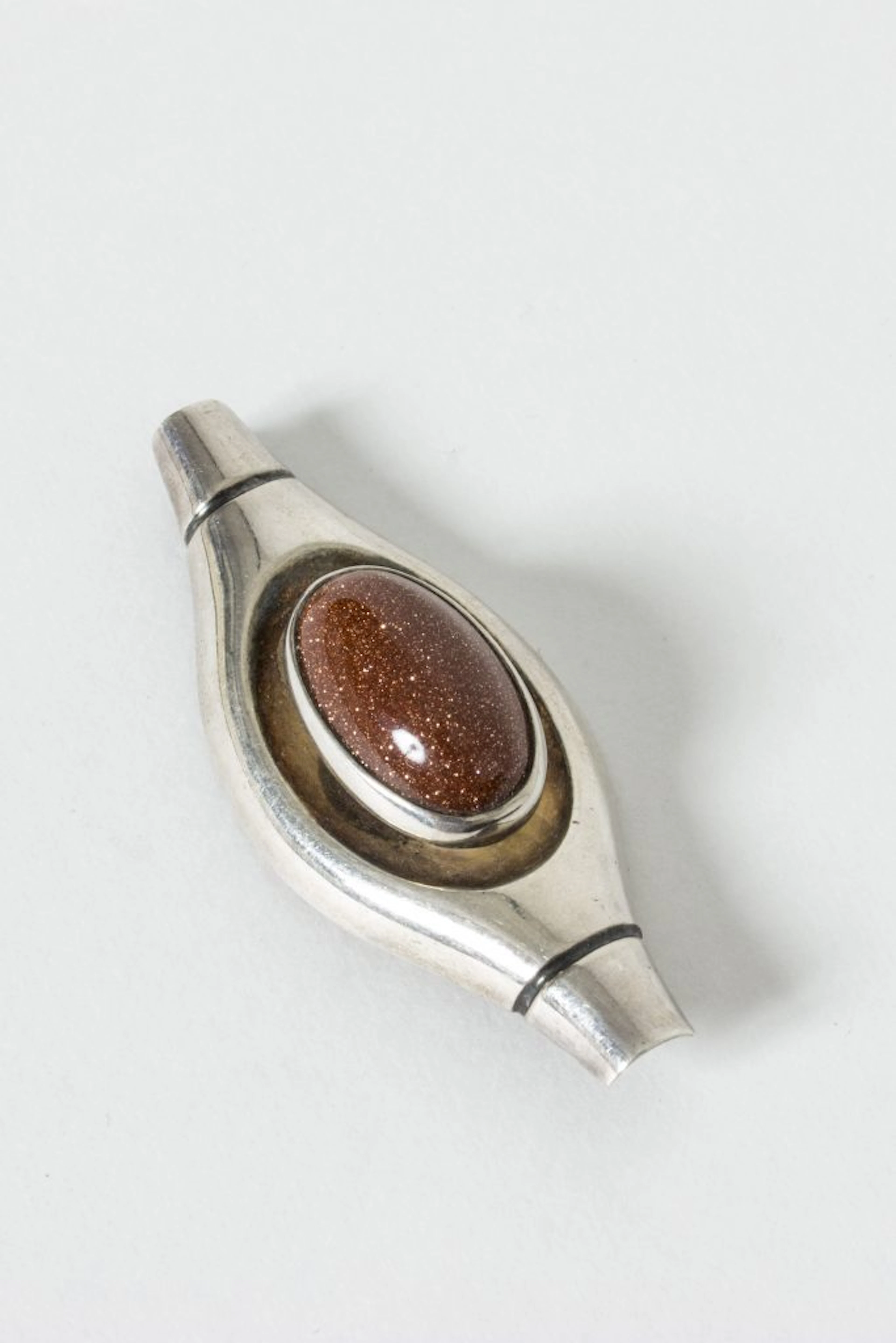 Silver and goldstone brooch by Elis Kauppi