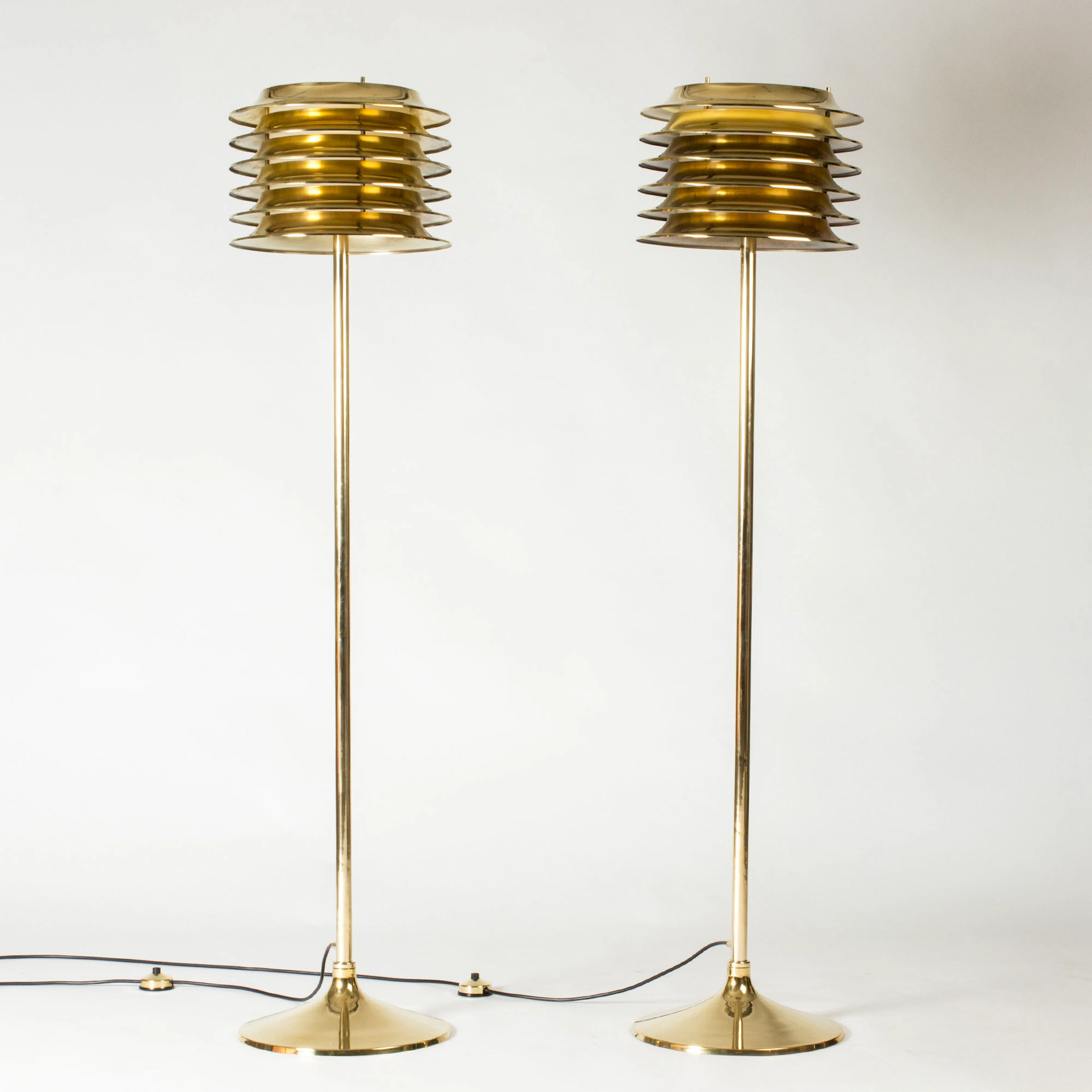 Midcentury brass floor lamps by Kai Ruokonen