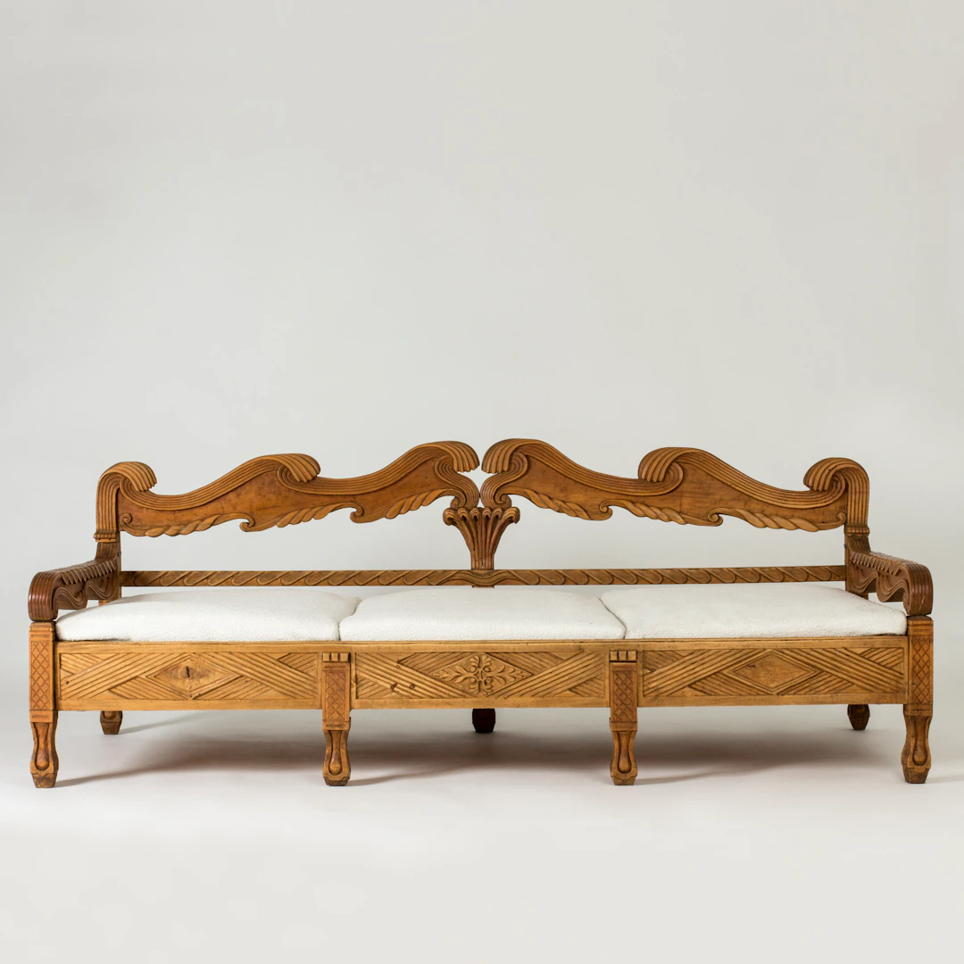 Carved wooden sofa by Knut Fjaestad