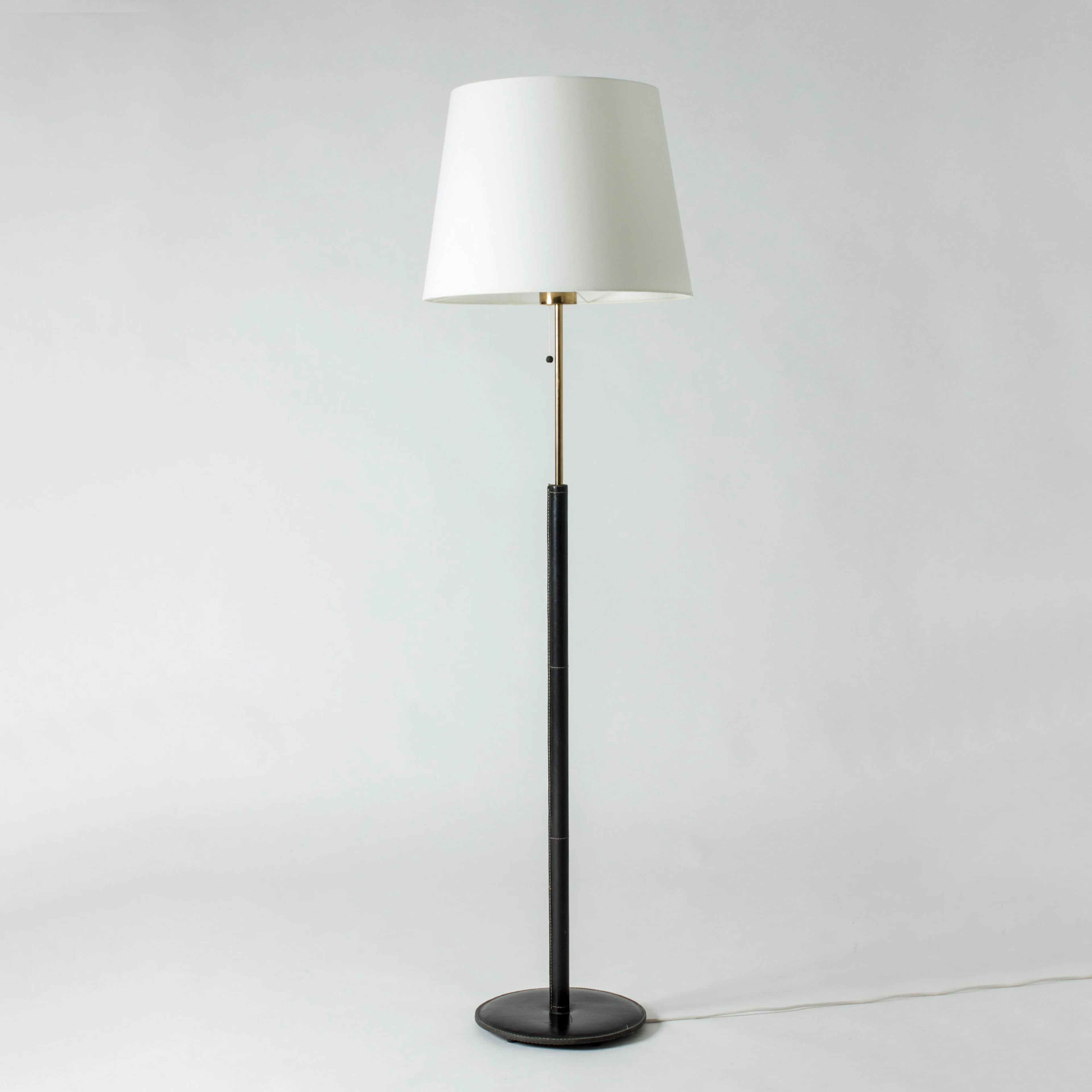 Brass and leather floor lamp from Bergboms