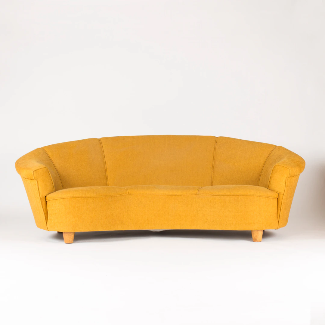 Arched three-seat sofa in the style of Otto Schulz
