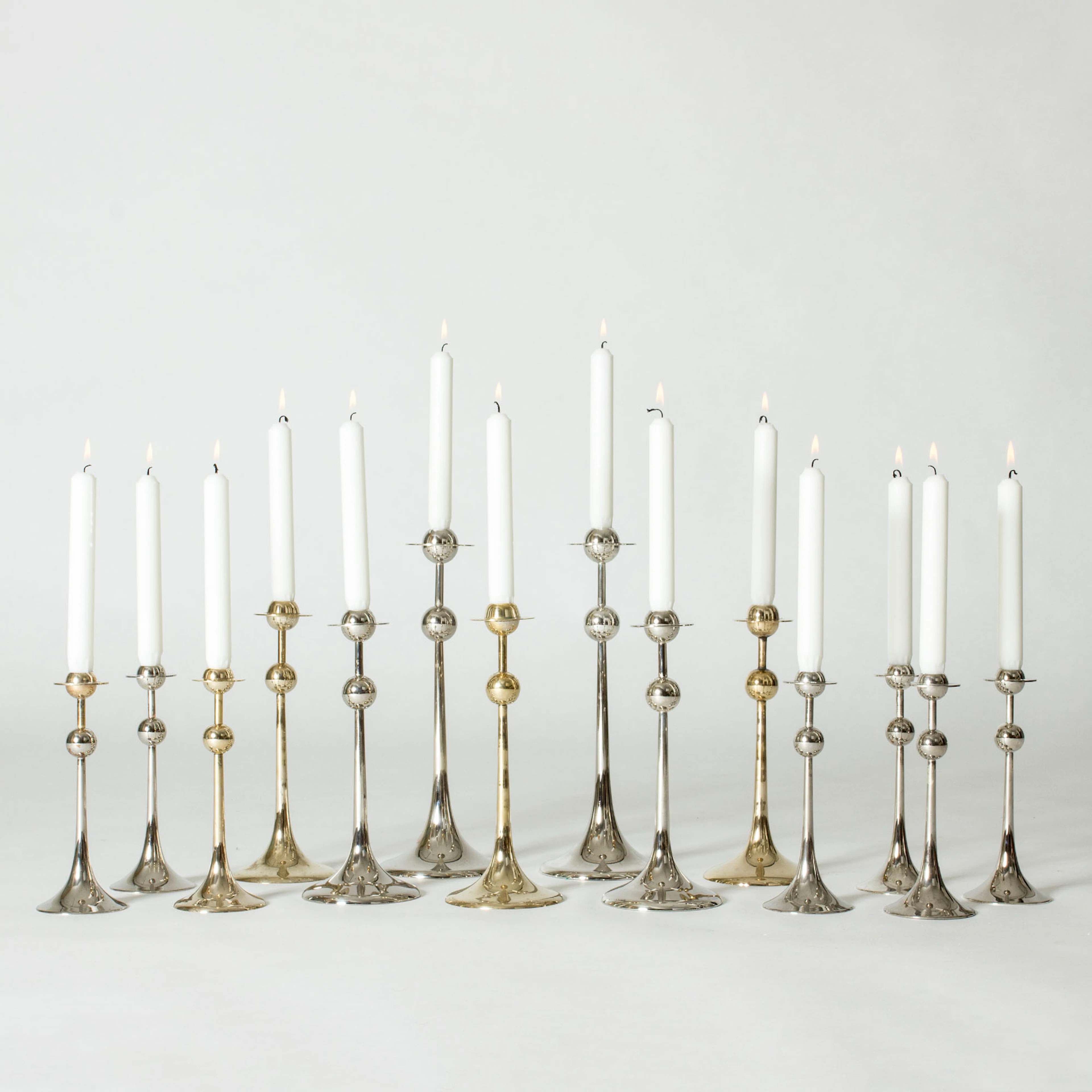 Set of 14 “Saturnus” candlesticks by Kjell Engman