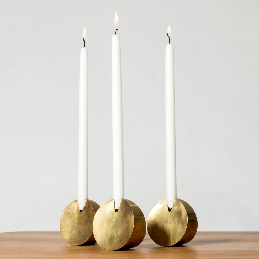 Brass candlesticks by Pierre Forssell