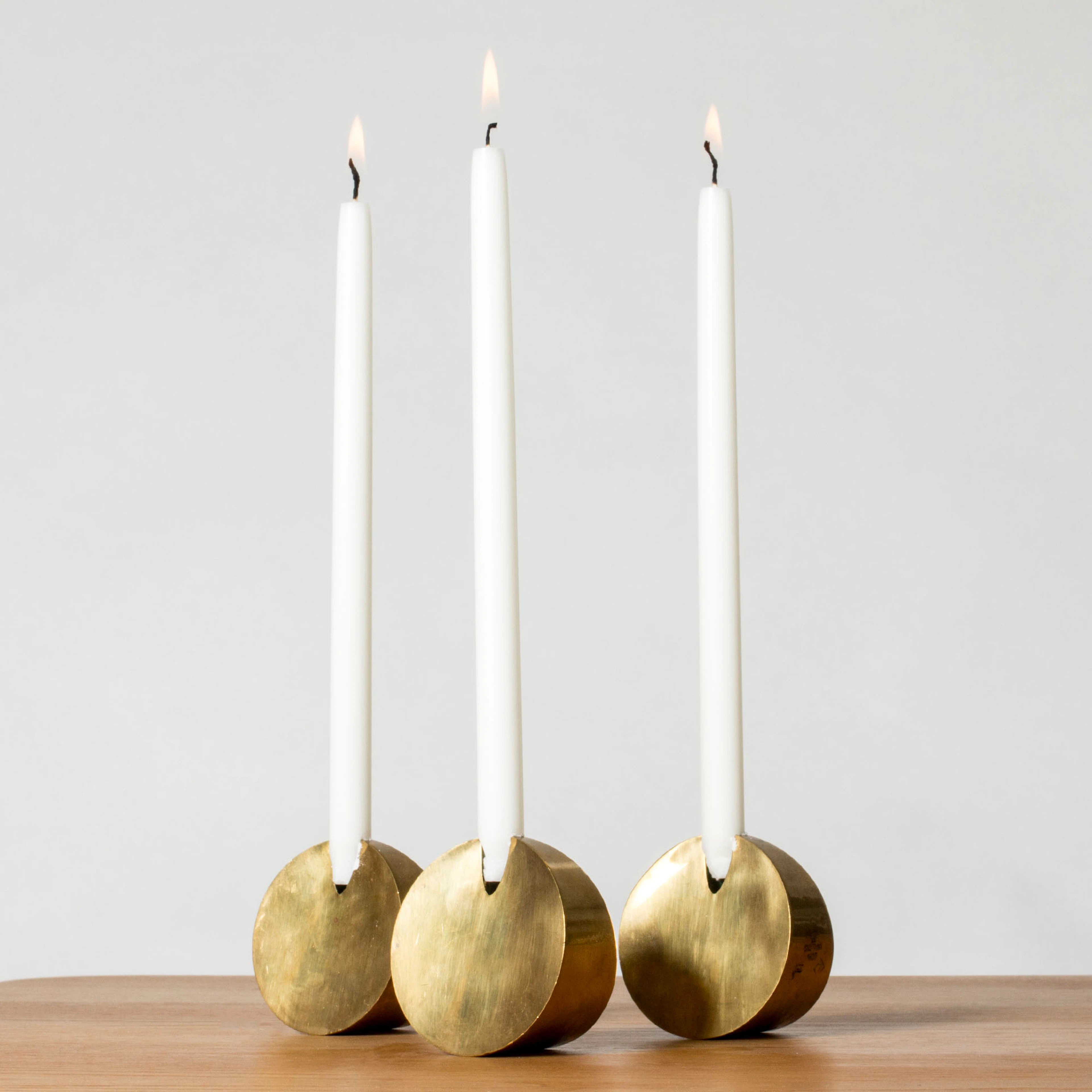 Brass candlesticks by Pierre Forssell