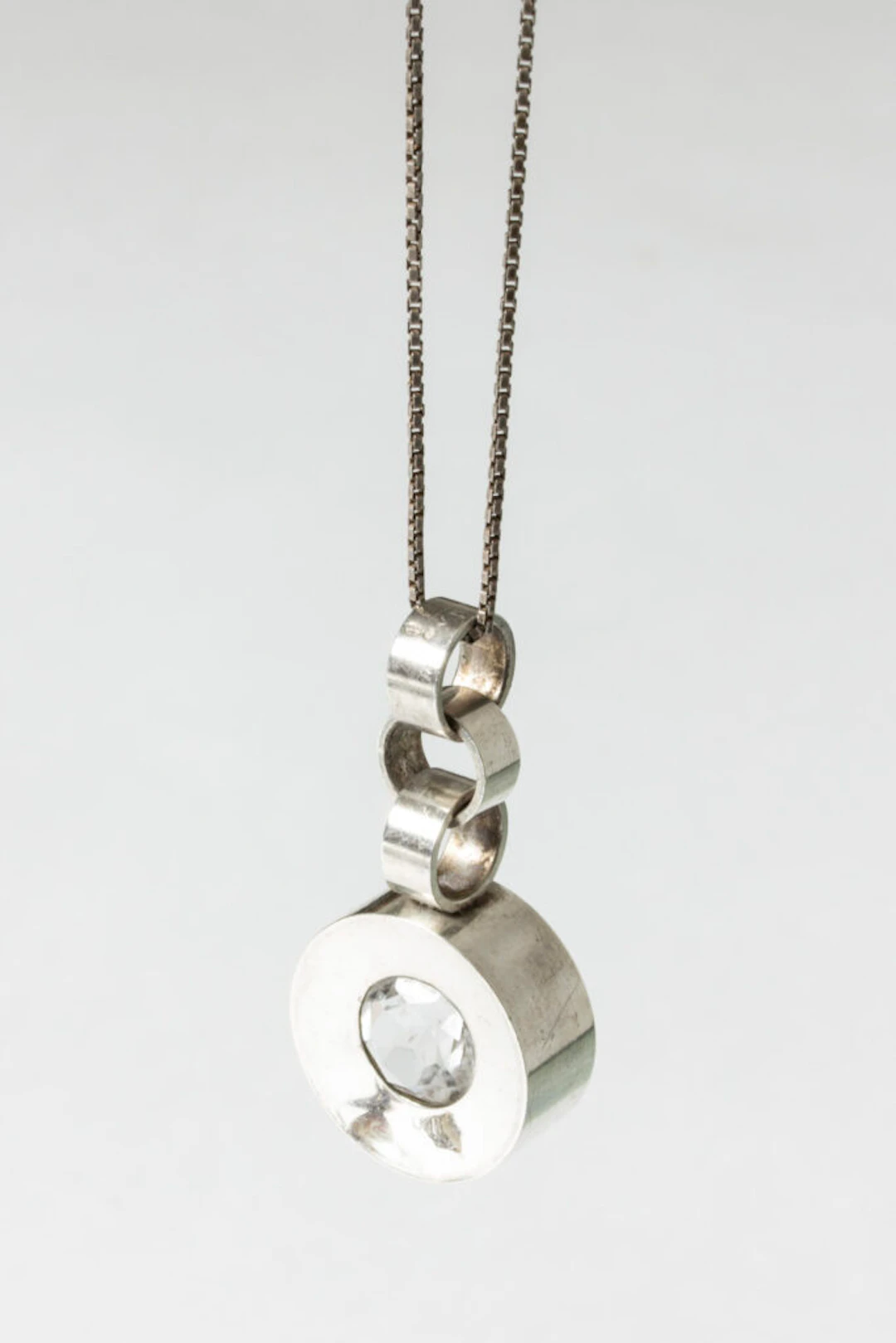 Silver and rock crystal pendant by Elis Kauppi