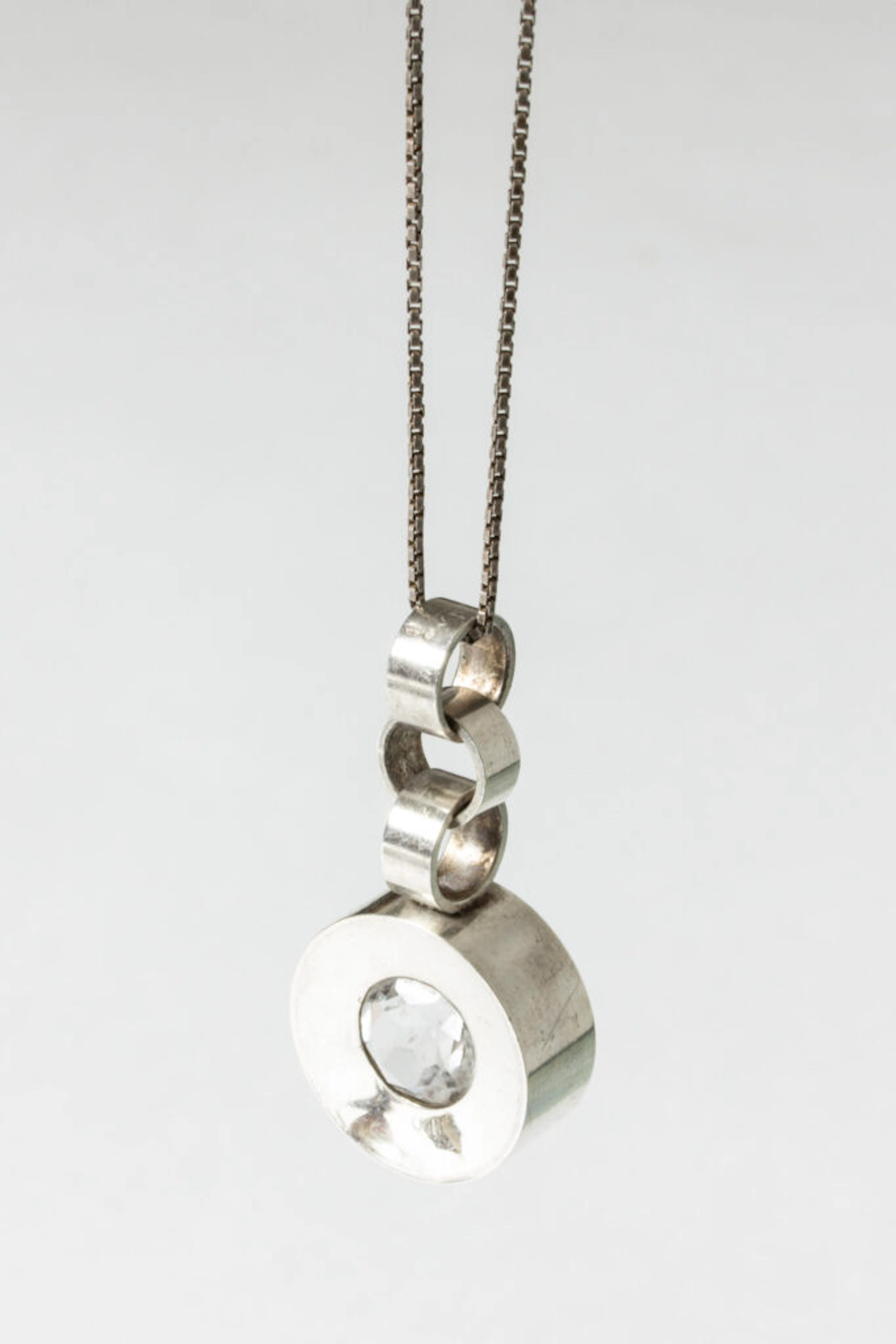 Silver and rock crystal pendant by Elis Kauppi